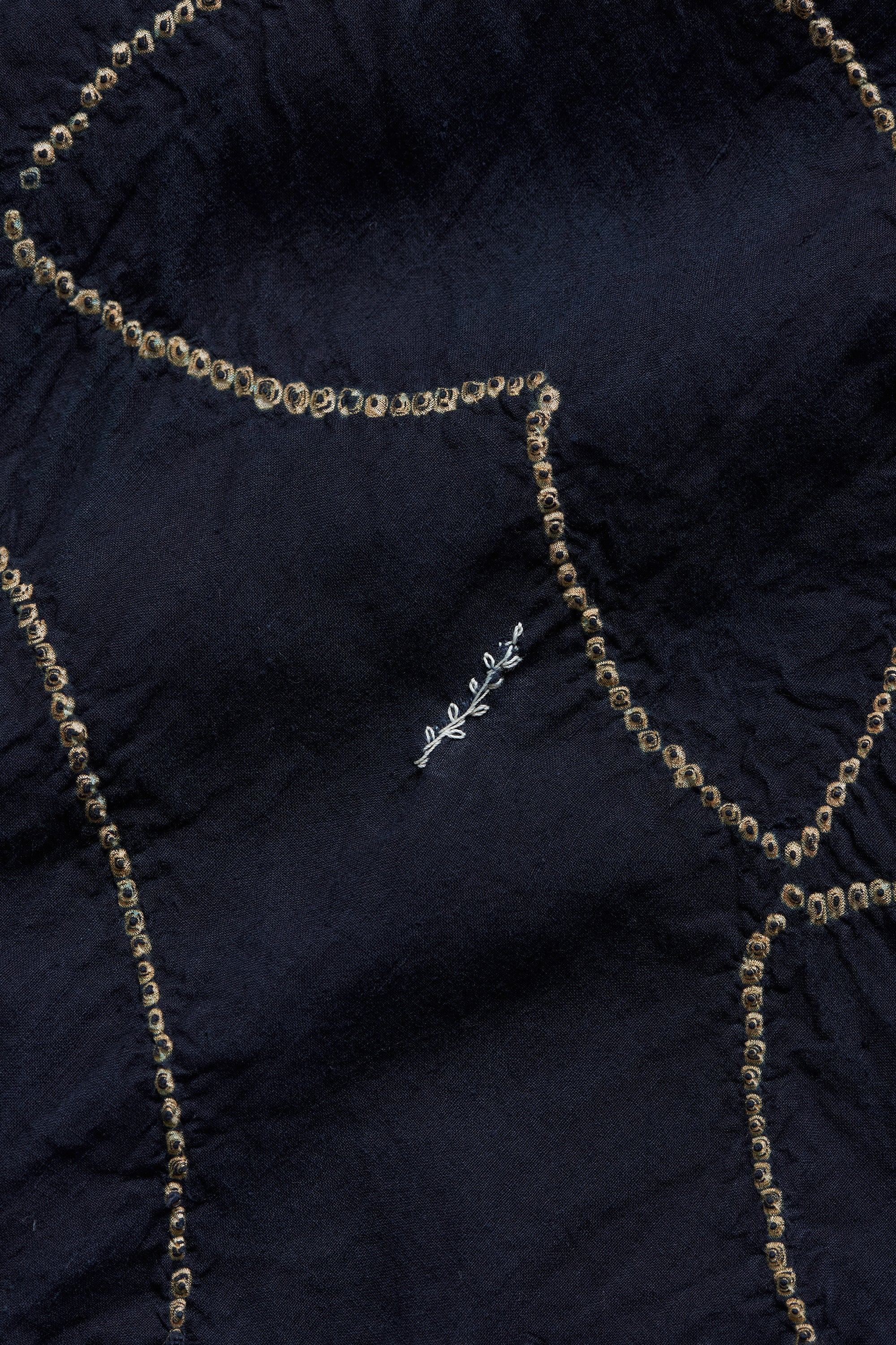 Navy blue fabric with gold chain