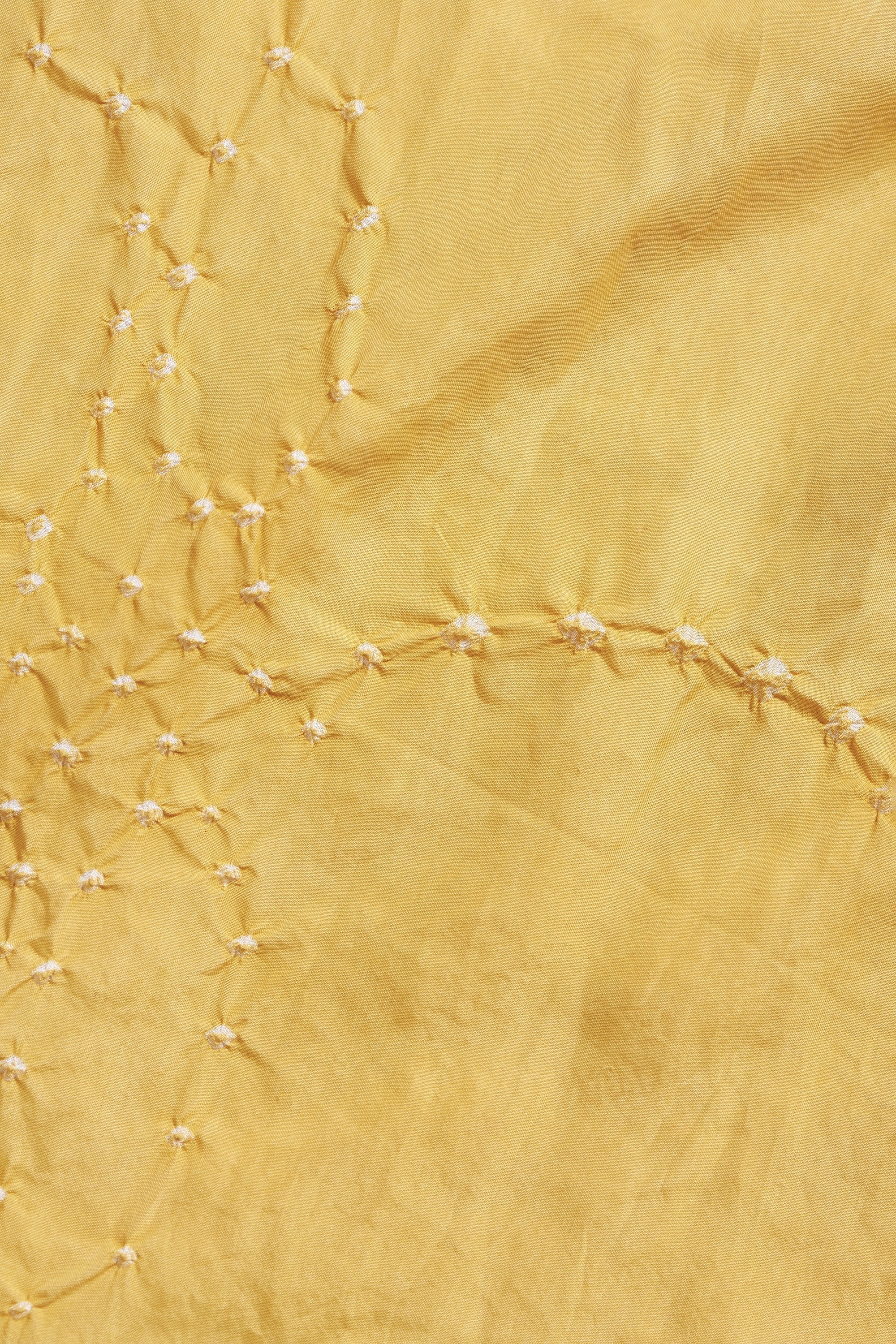 Close-up of yellow fabric