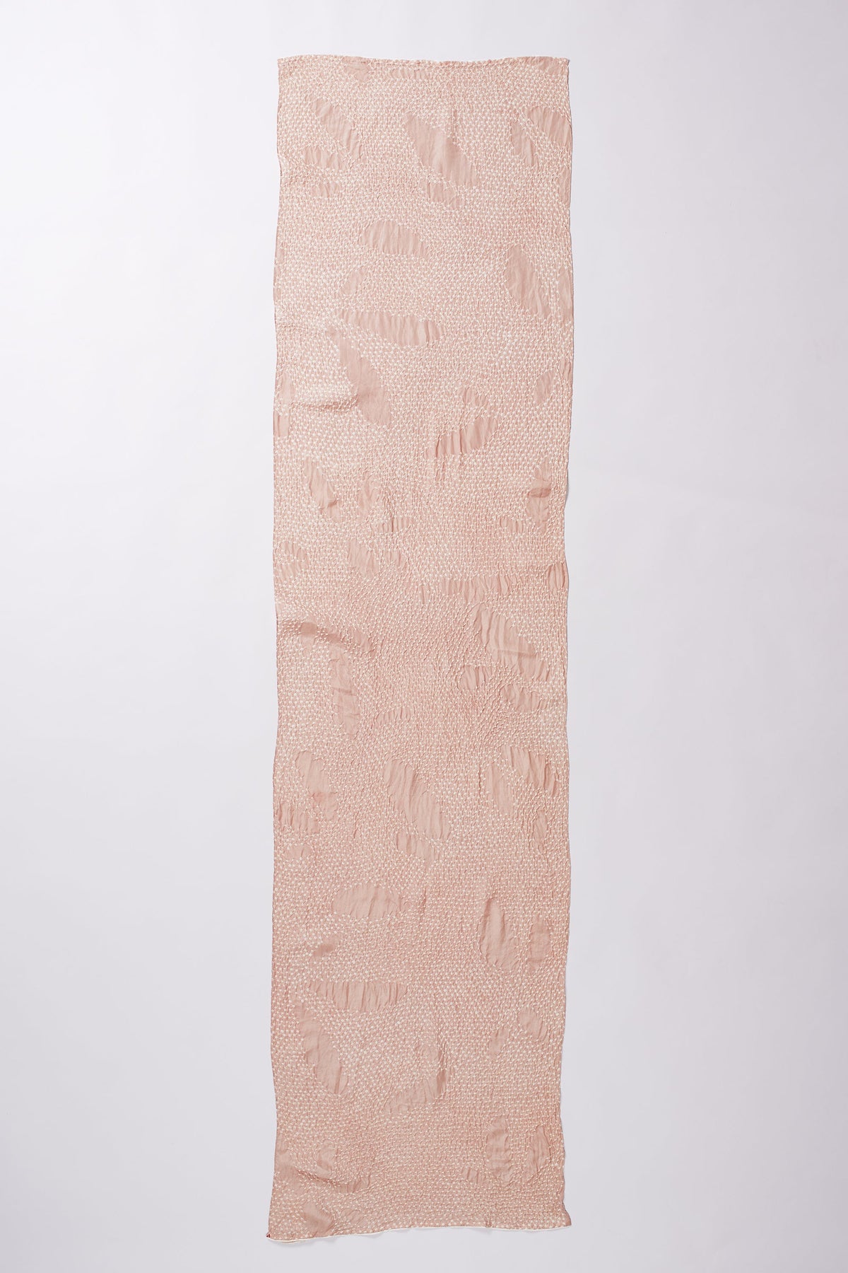 Long rectangular piece of light pink fabric