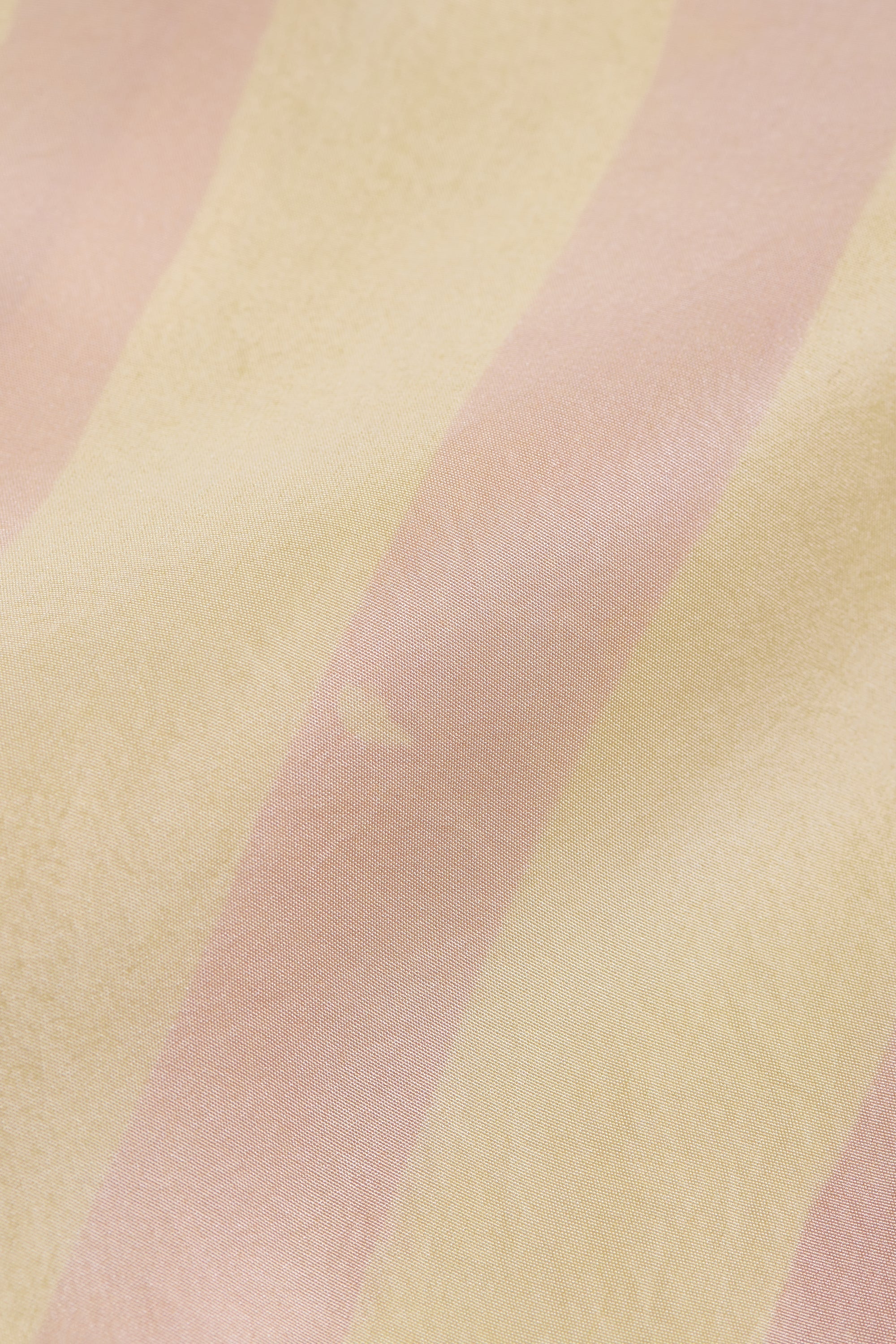 Close-up of pastel pink and yellow fabric texture