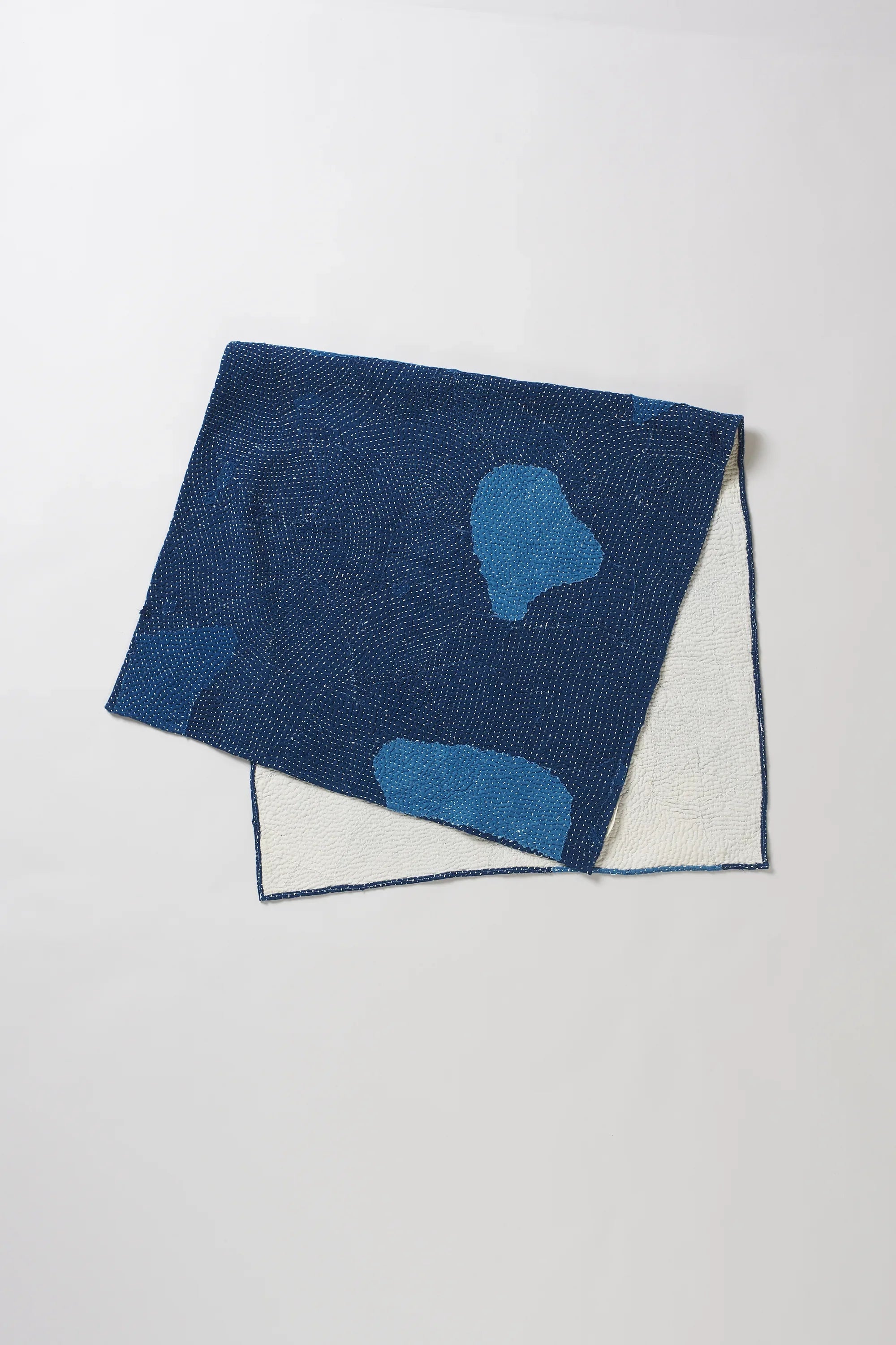 Folded indigo quilt