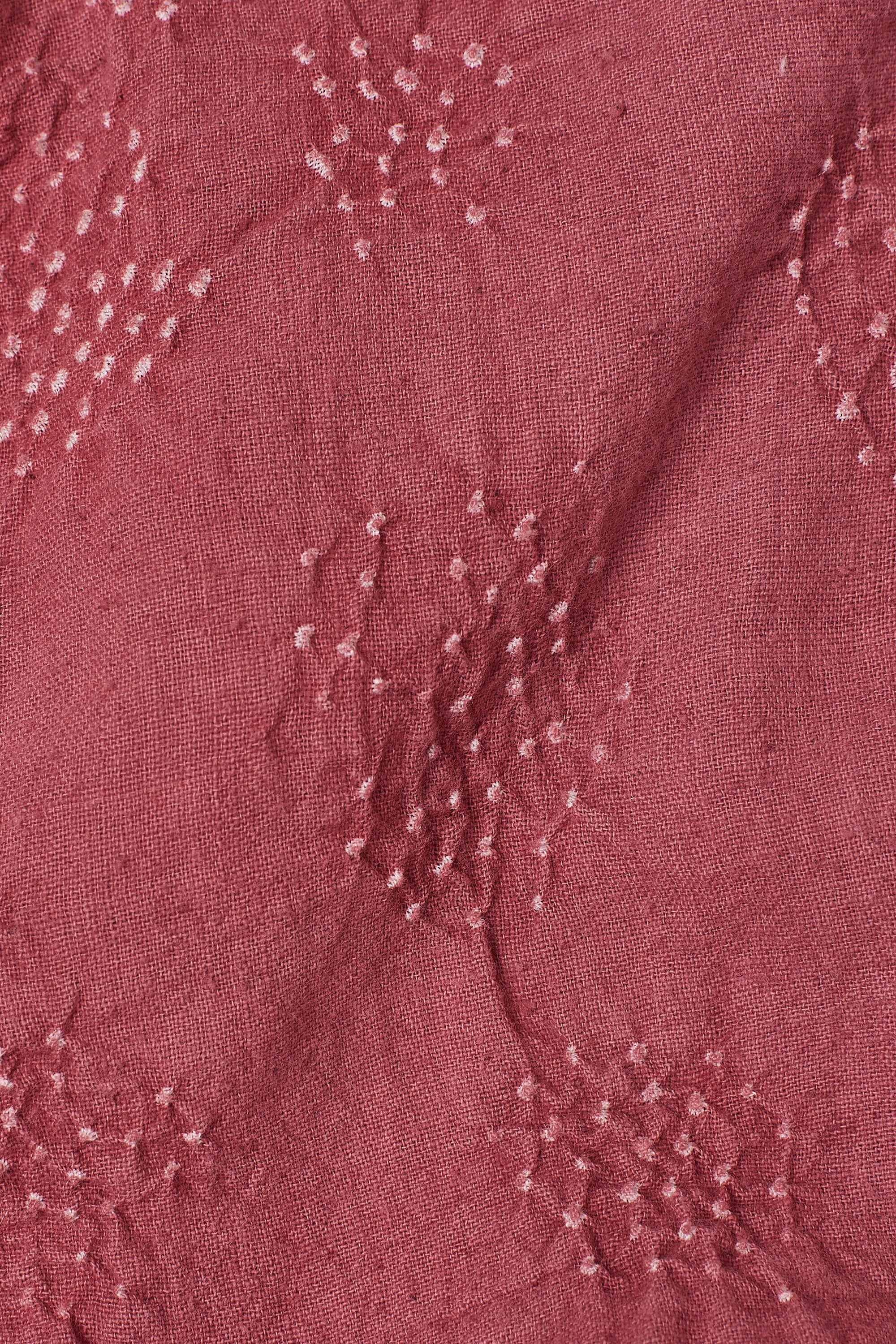 Close-up of a textured purple fabric