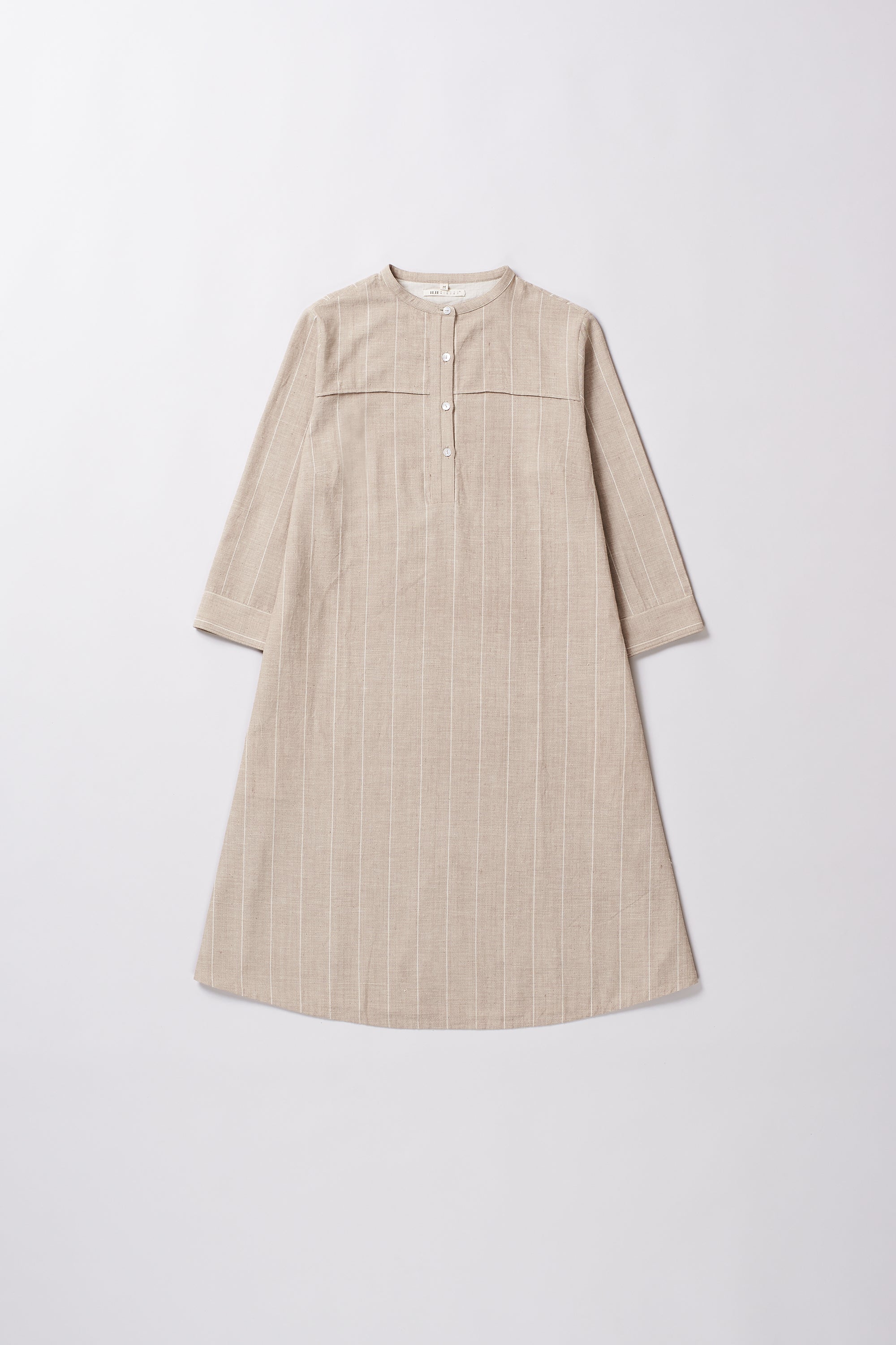 Beige dress with a subtle pattern