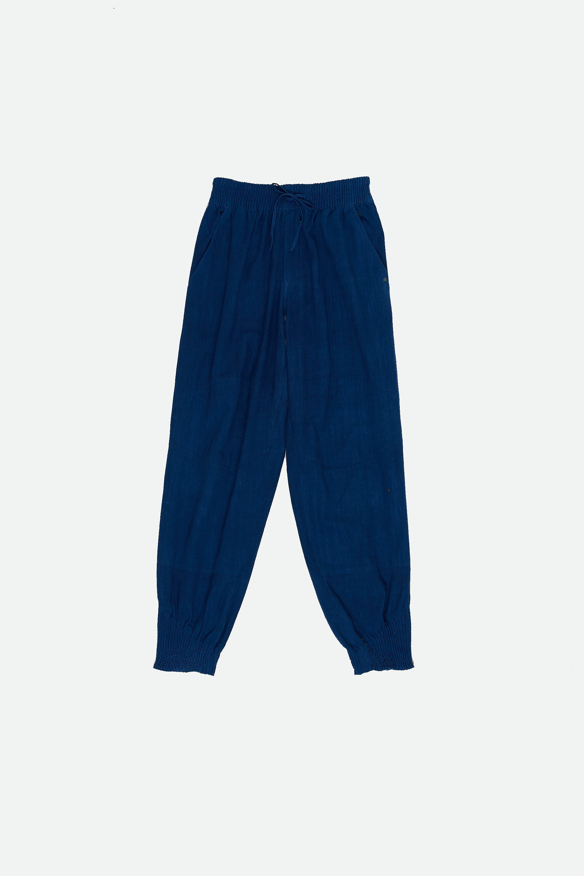 Front image of a medium indigo cotton pant with drawstring