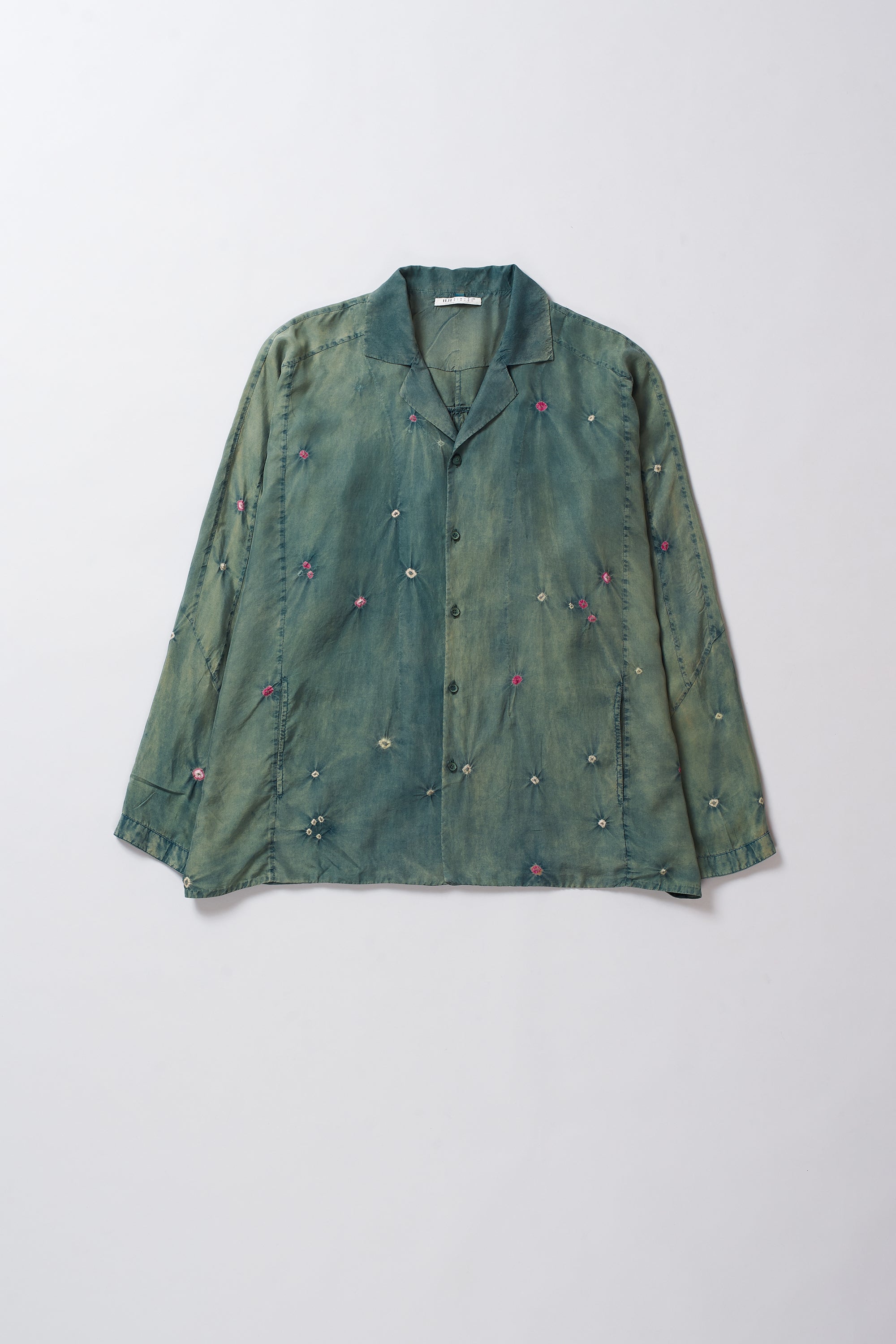 Green shirt with decorative elements