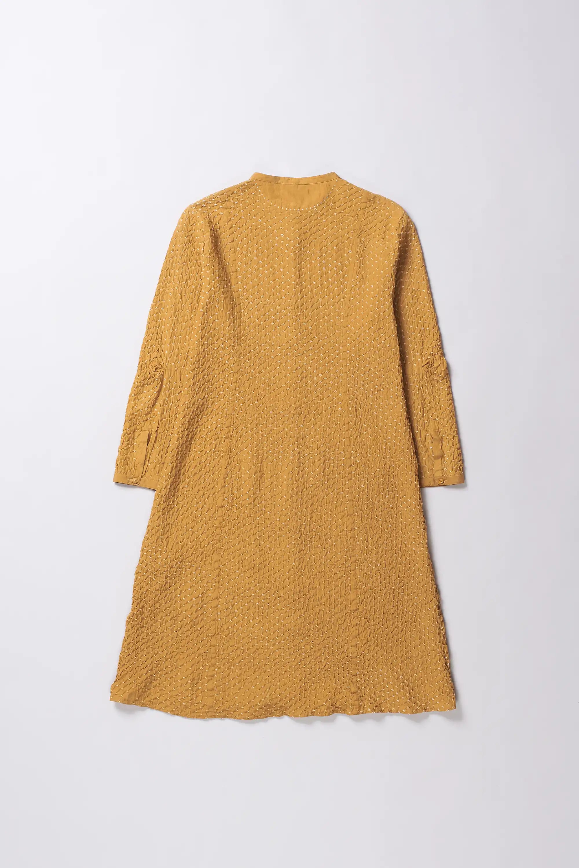 Yellow textured dress on a white background