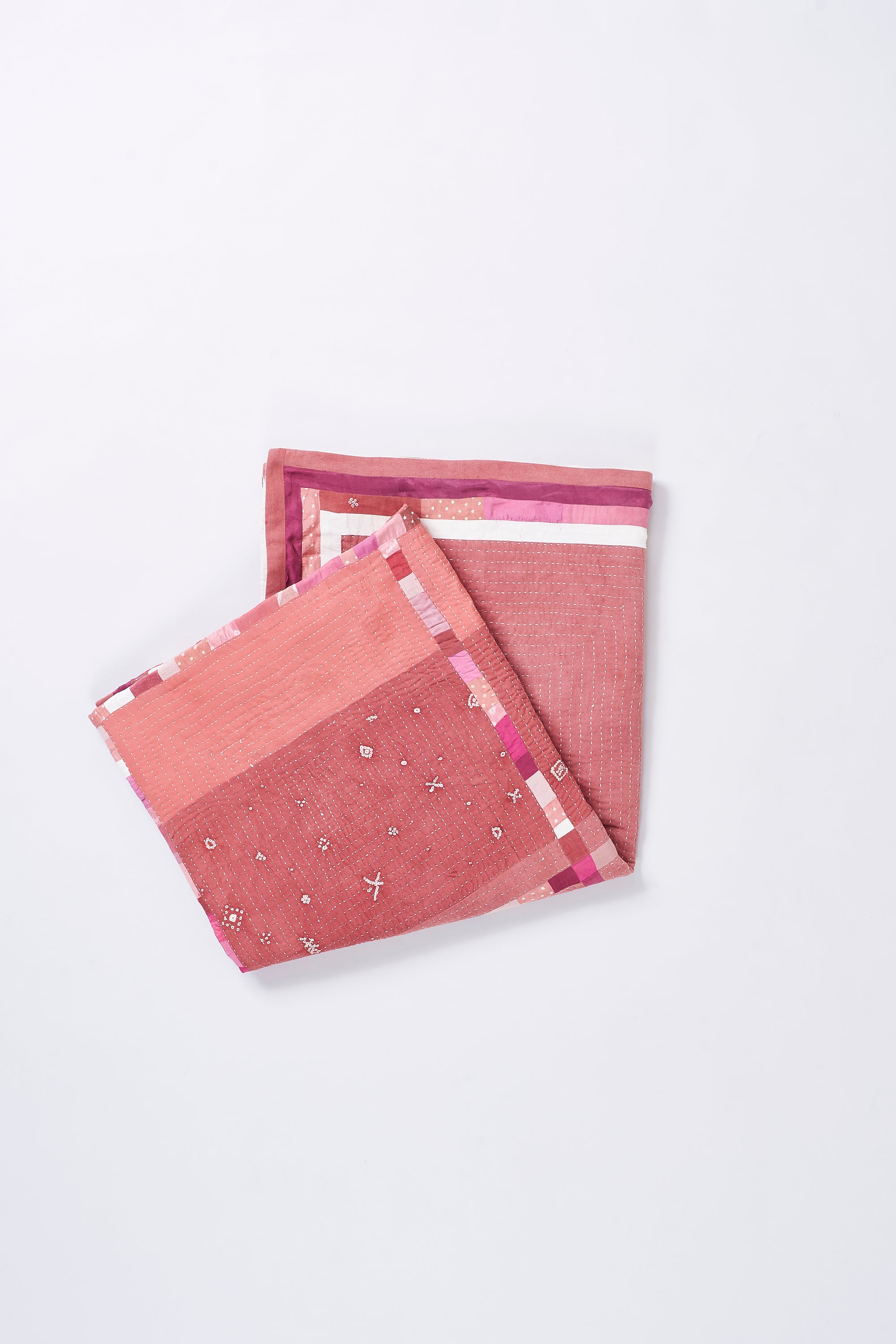 HAND EMBROIDERED PATCHWORK QUILT IN PINK WOOD