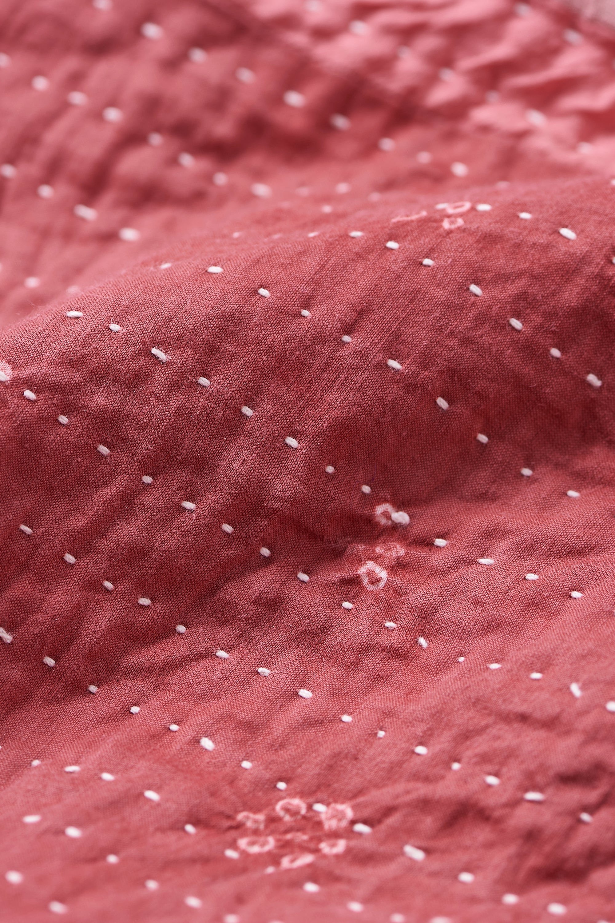 HAND EMBROIDERED PATCHWORK QUILT IN PINK WOOD