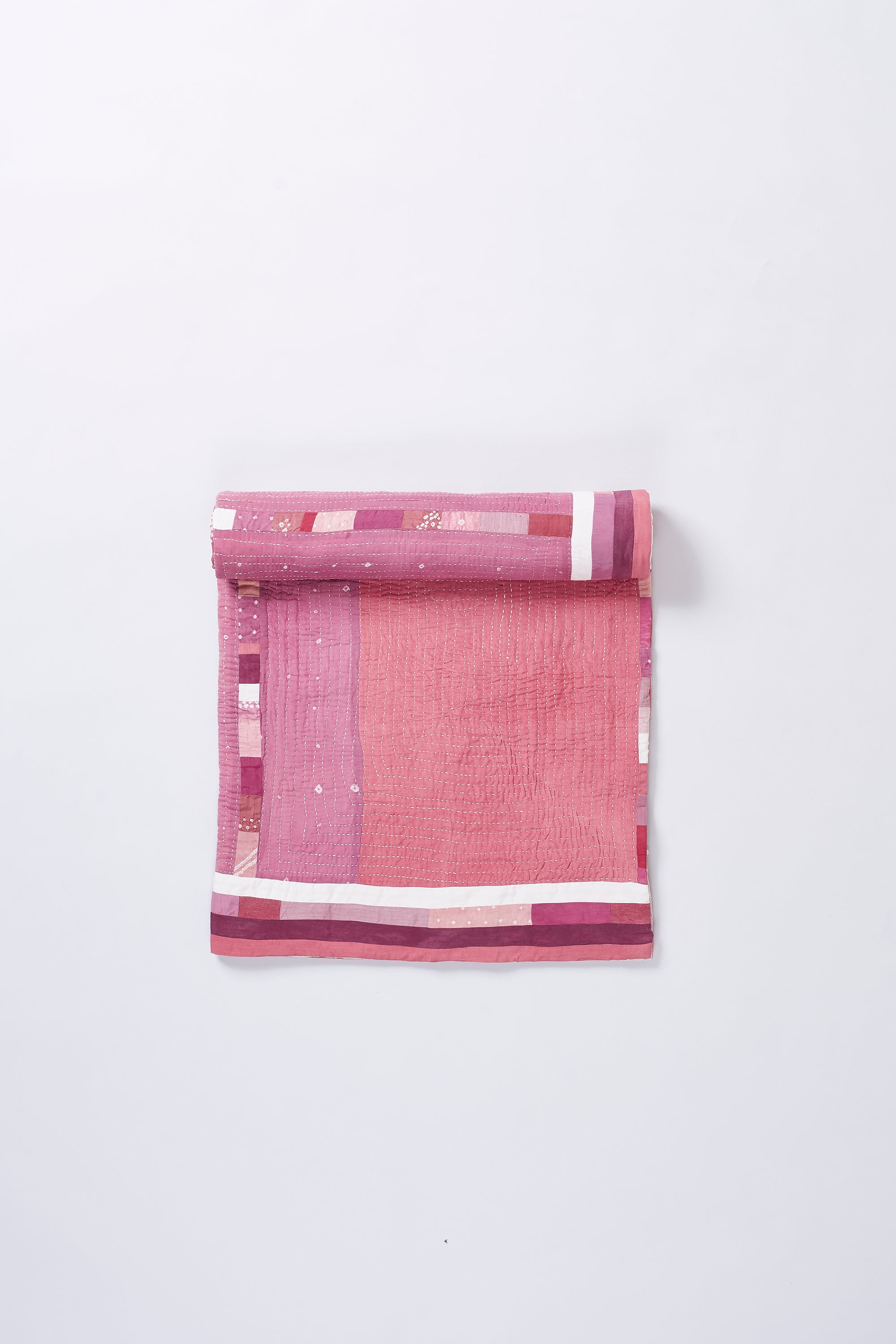 HAND EMBROIDERED PATCHWORK QUILT IN PINK WOOD