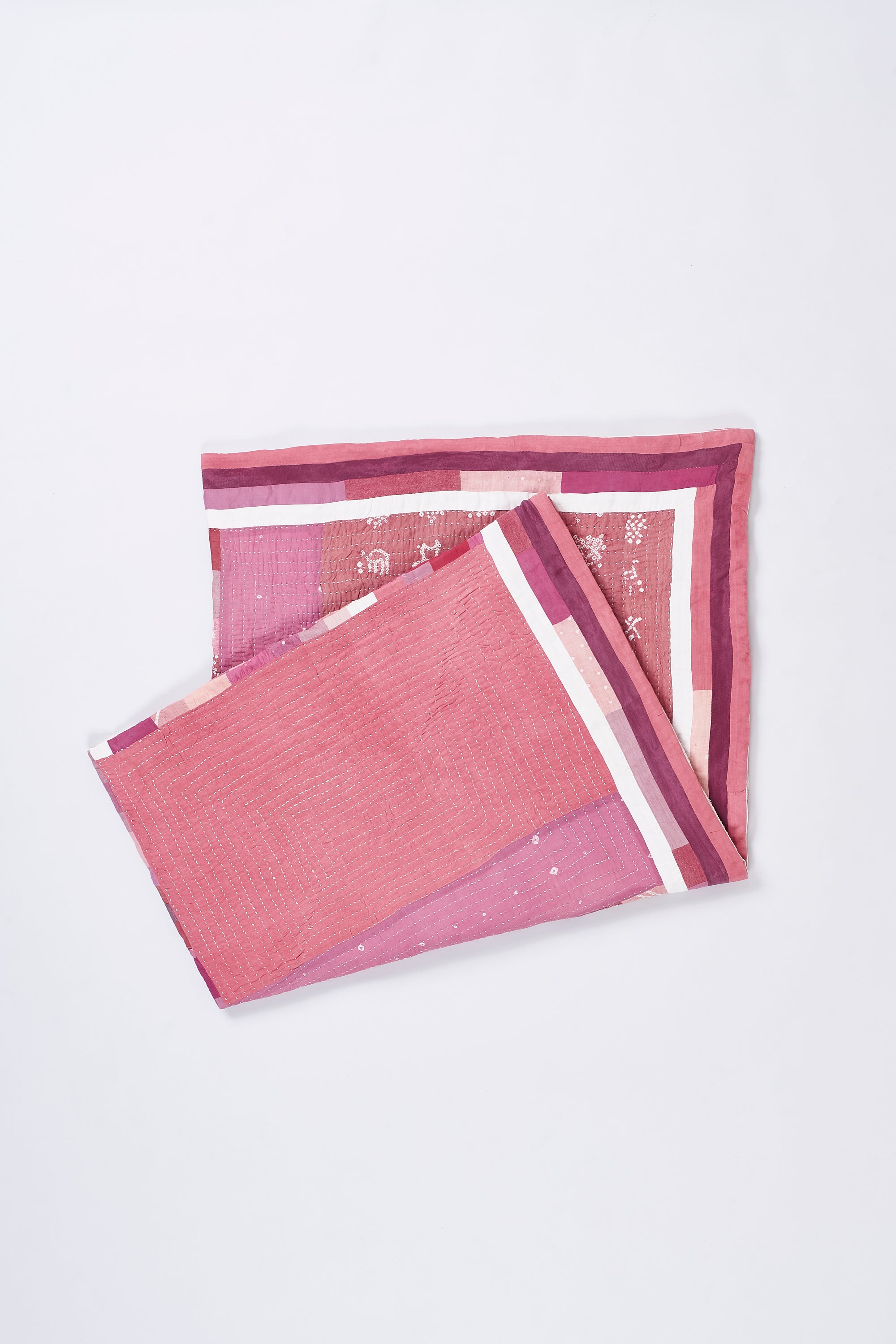 HAND EMBROIDERED PATCHWORK QUILT IN PINK WOOD