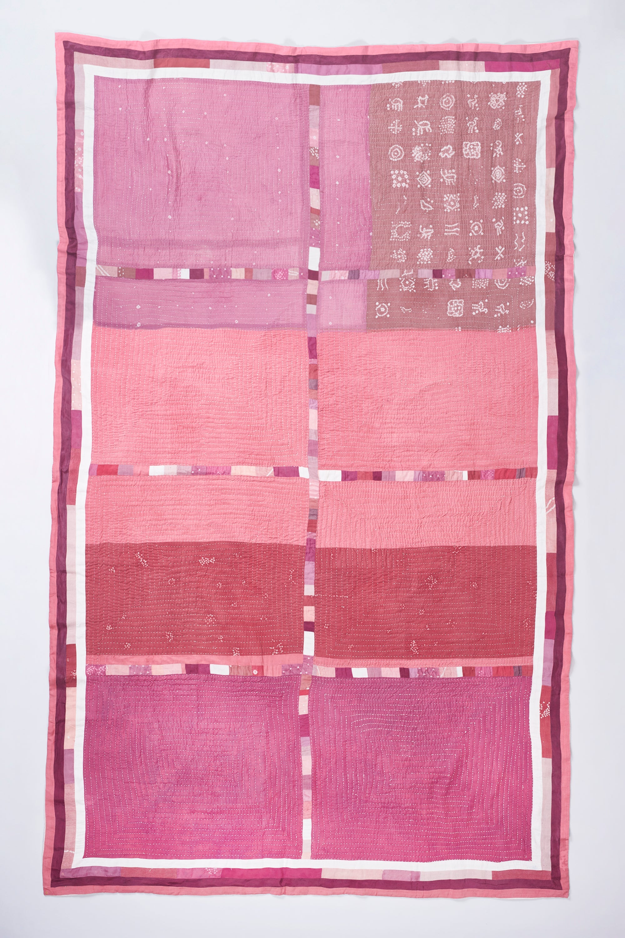 HAND EMBROIDERED PATCHWORK QUILT IN PINK WOOD