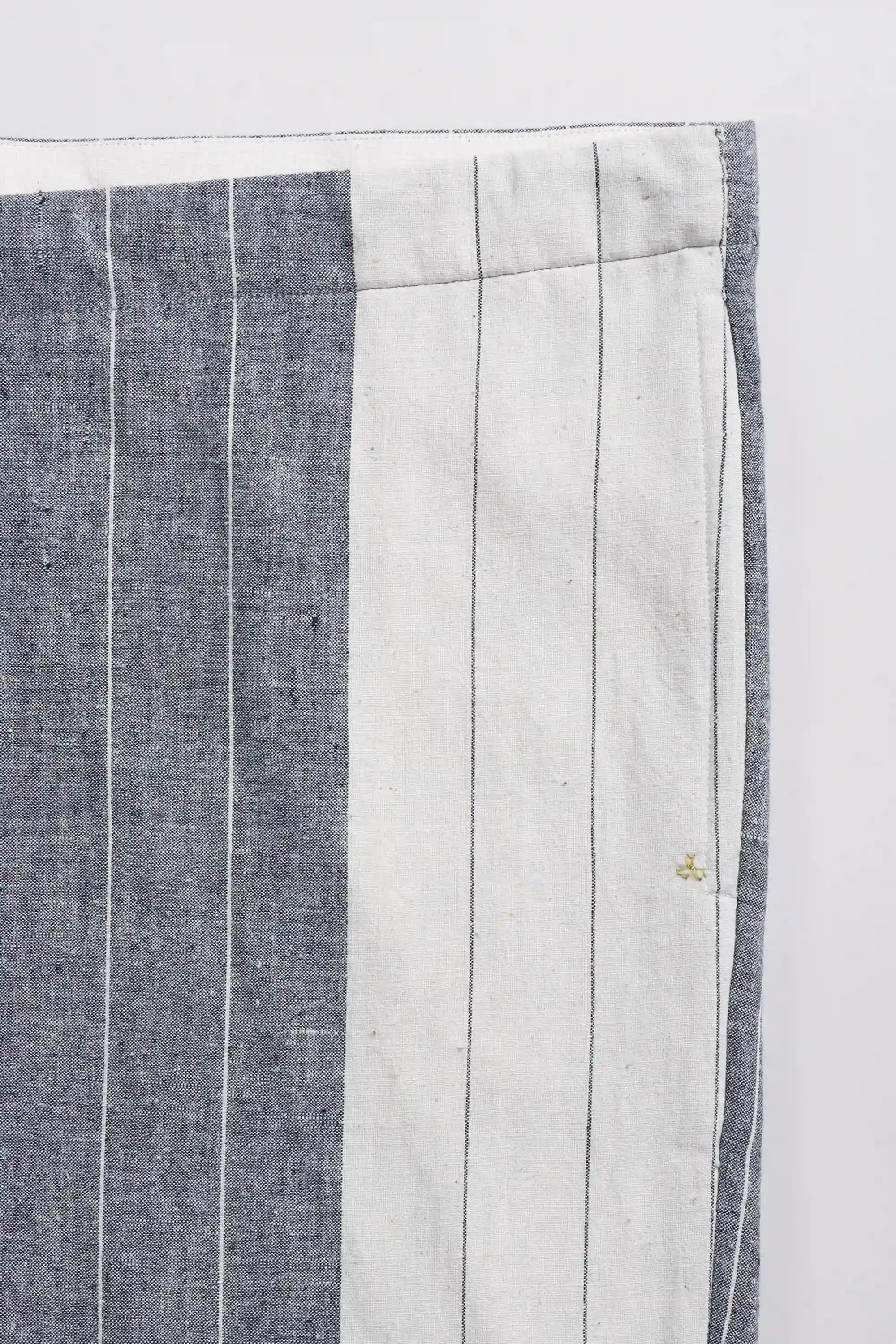 Striped fabric with blue and white pattern on a white background