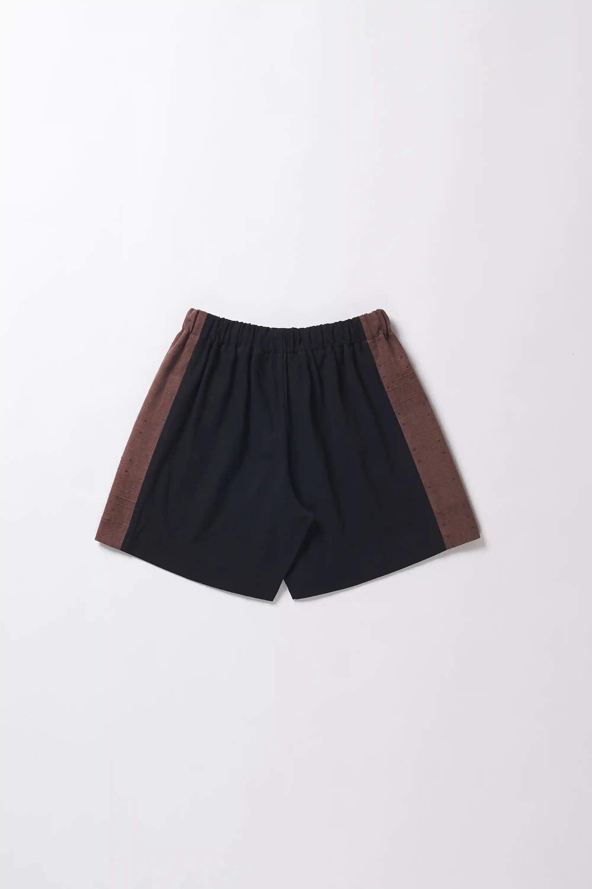 Back image of shorts with brown accents on a light grey background