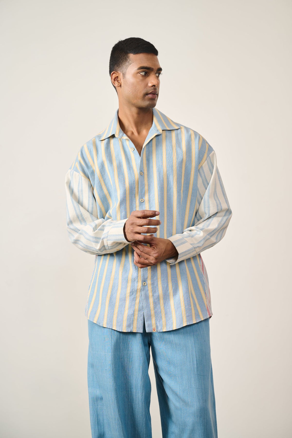 A man wearing multi colour cotton shirt