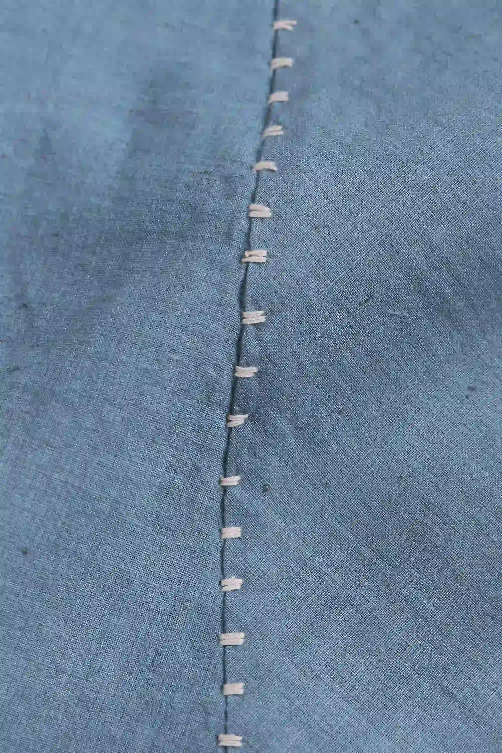 Fabric close-up with hand detailing