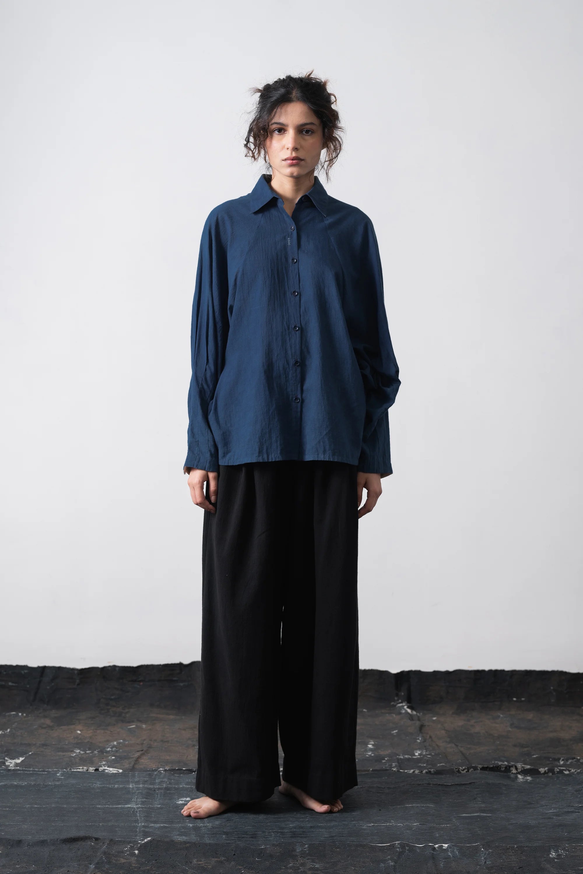 A woman wearing cotton medium indigo shirt