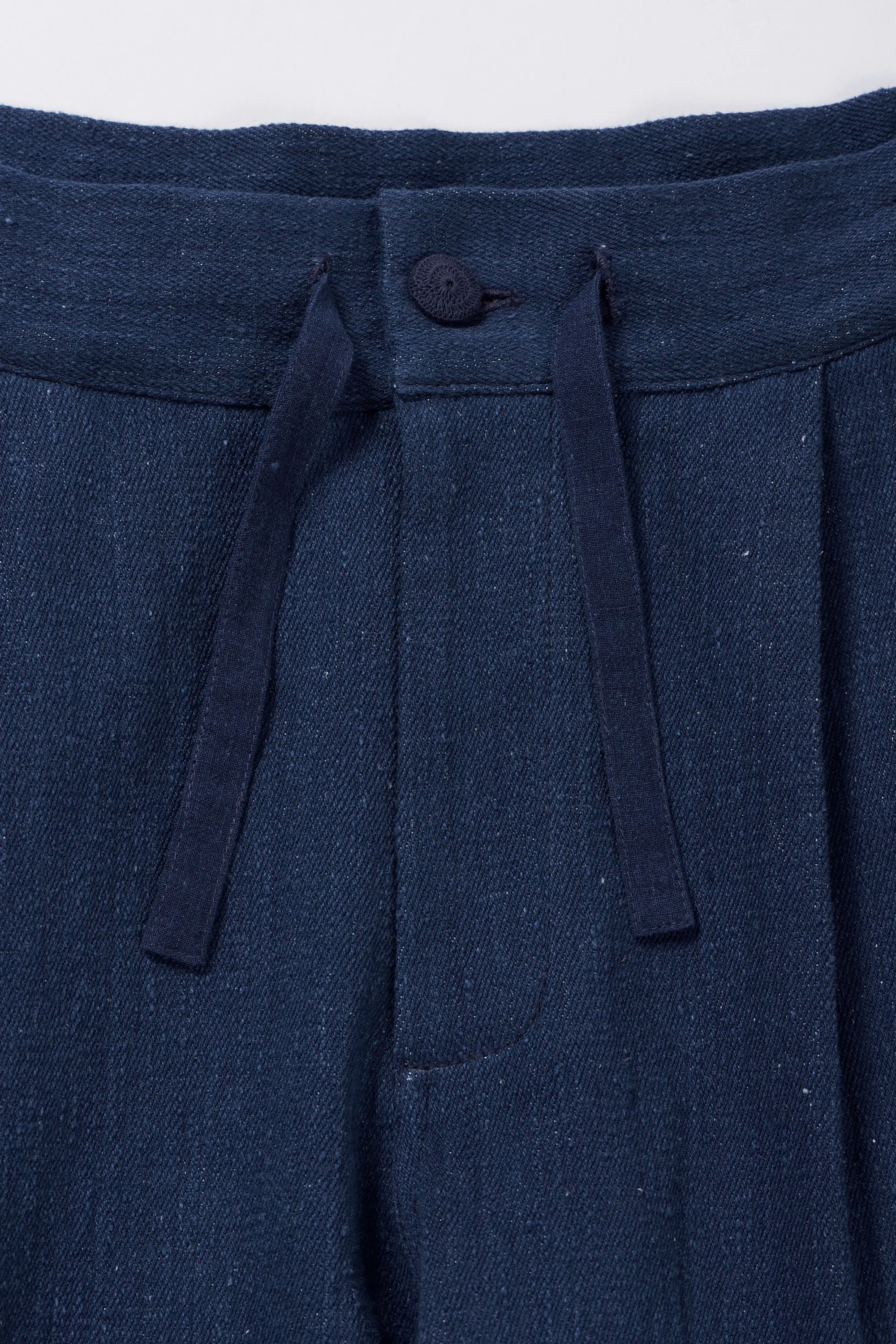 Fabric close-up with button and drawstring