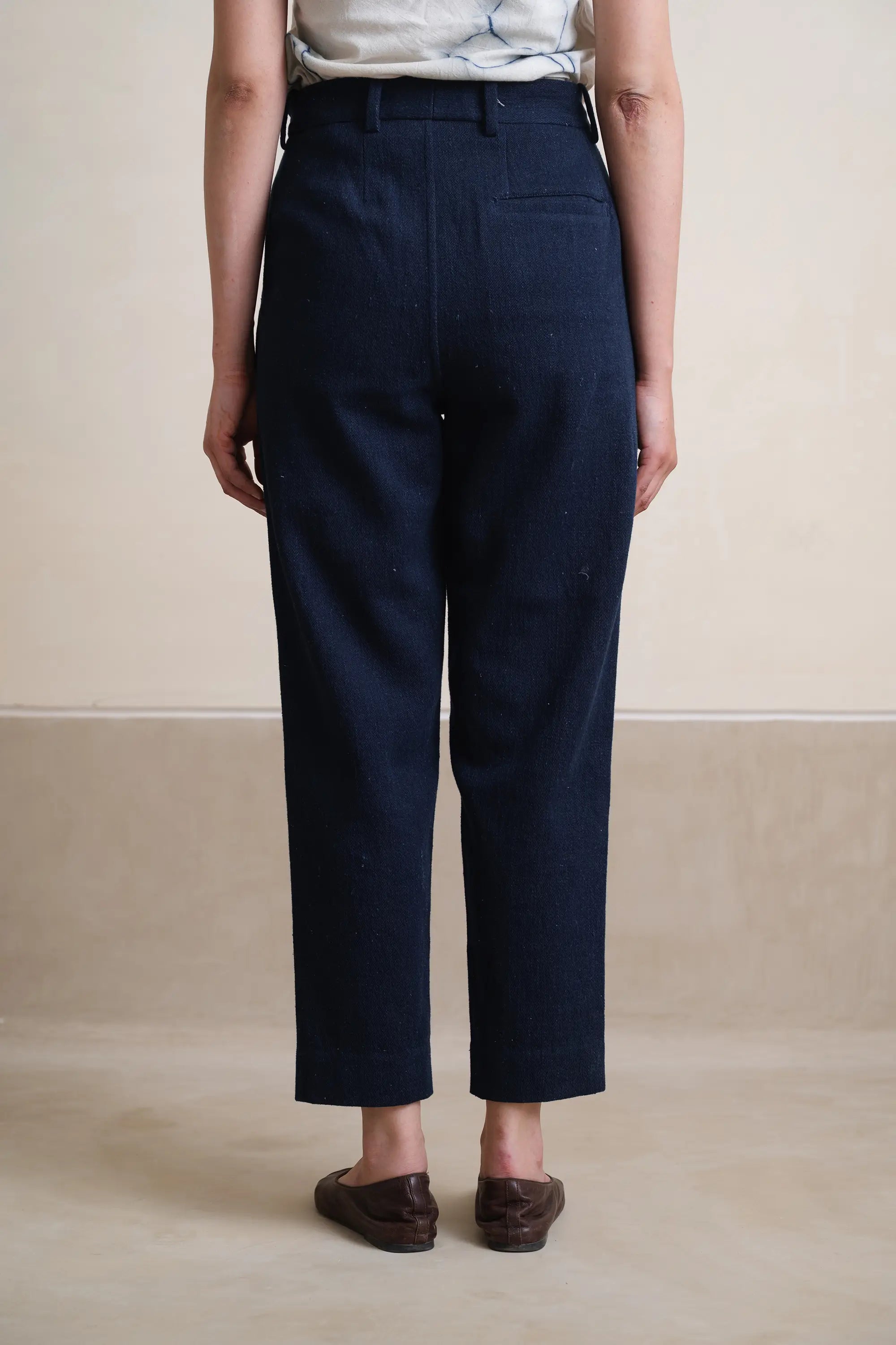 A back shot of woman wearing indigo cotton pant