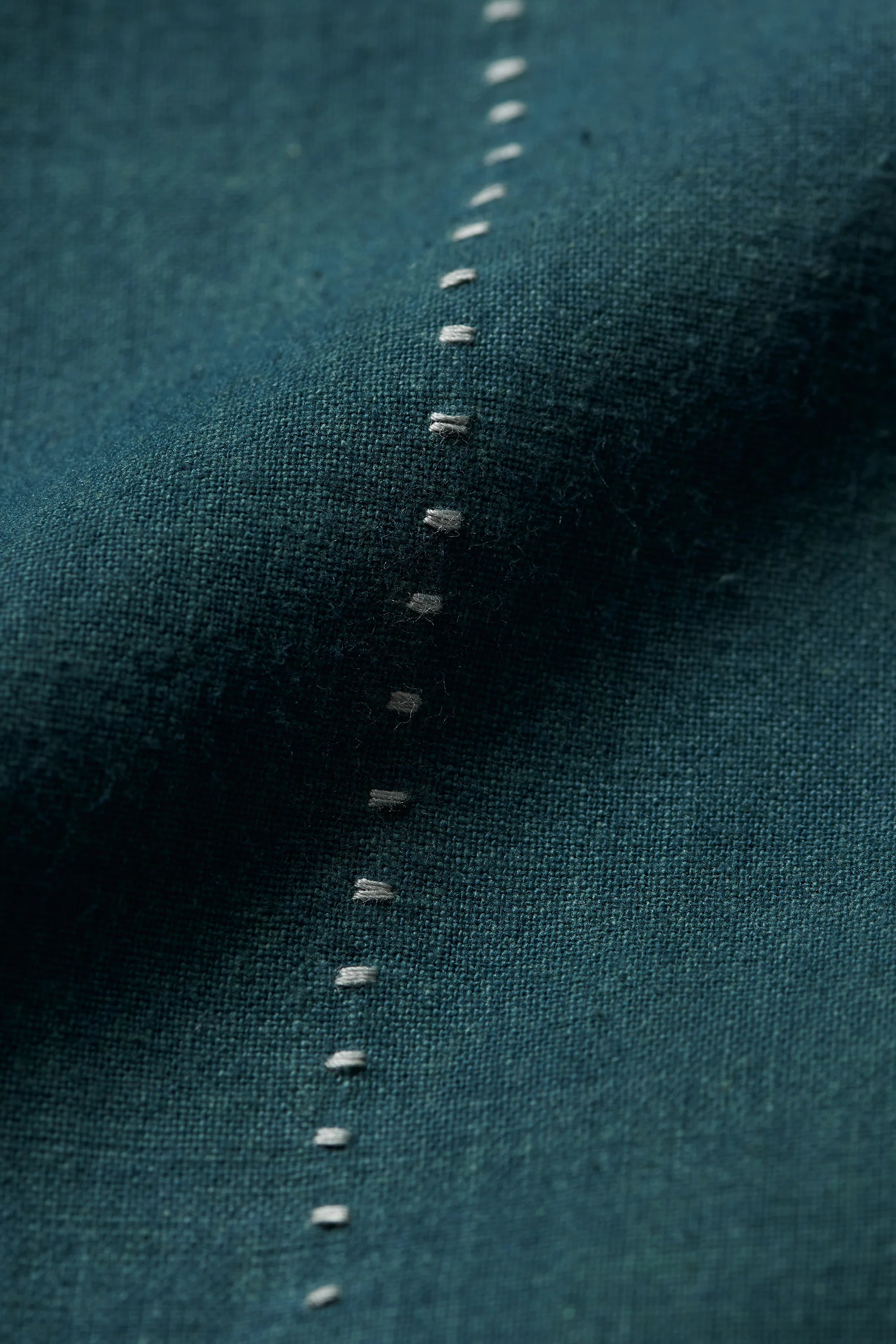 Fabric close-up with hand detailing