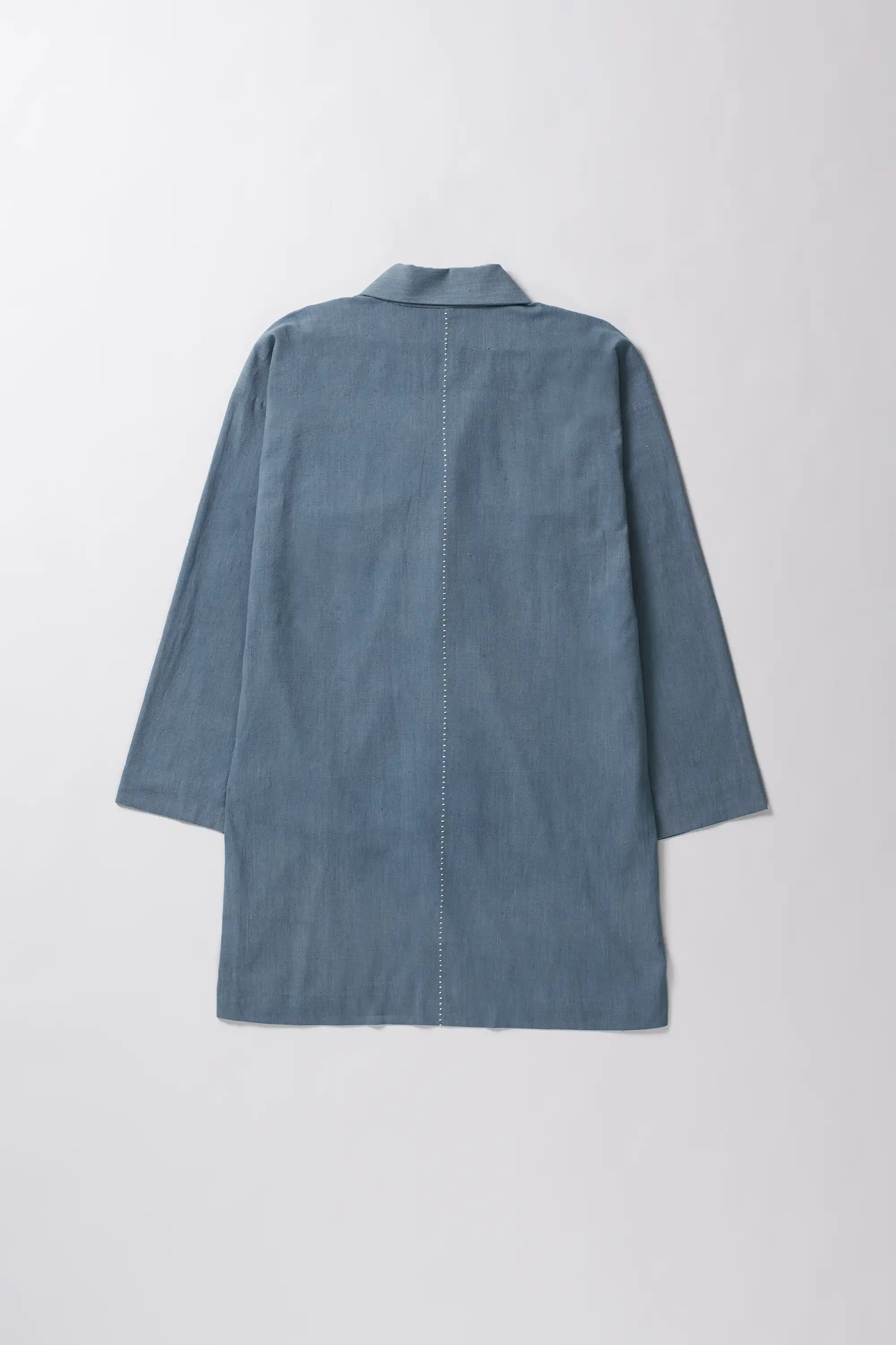 Blue cotton jacket on a light grey background