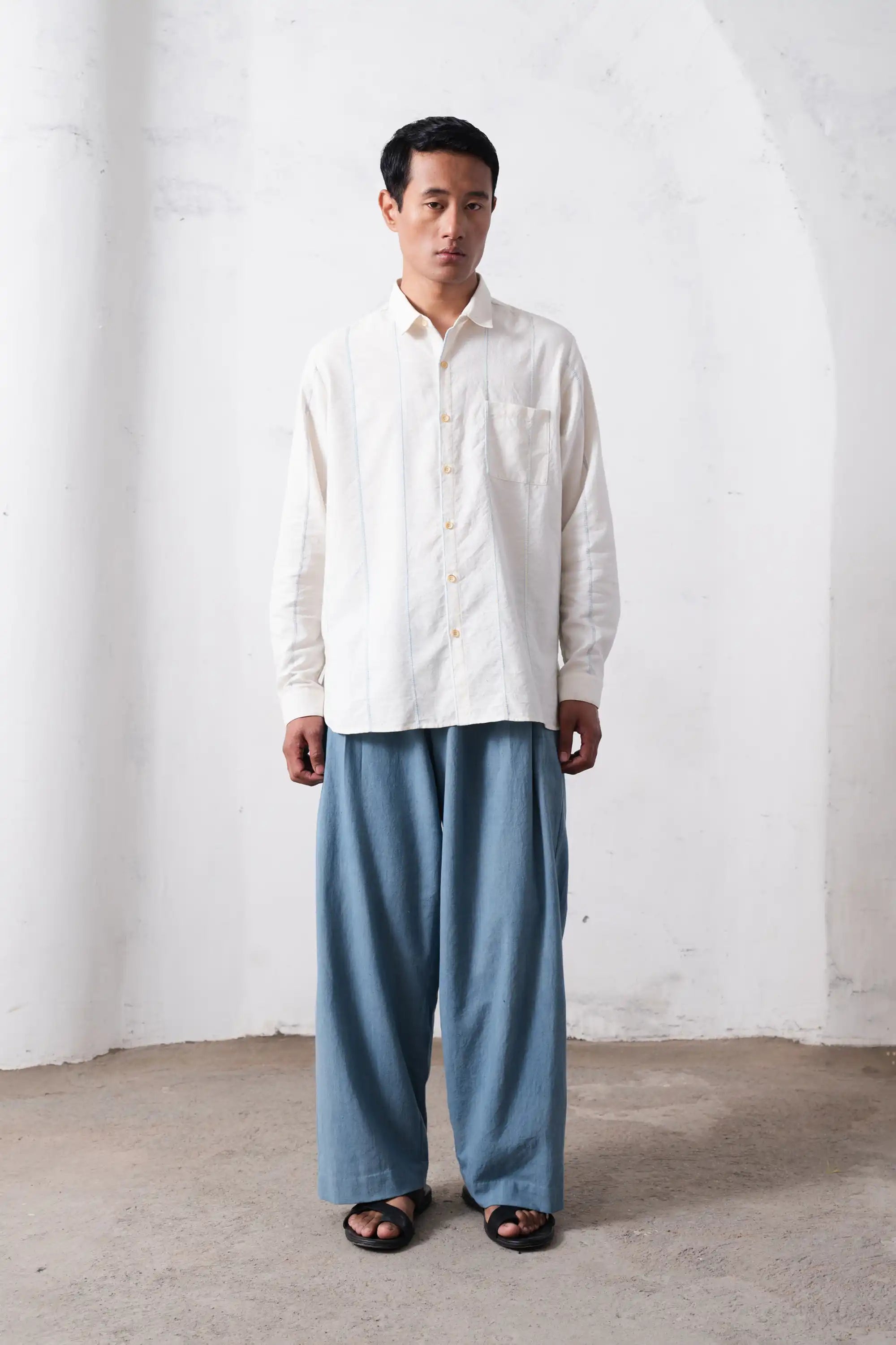 A man wearing ecru cotton shirt