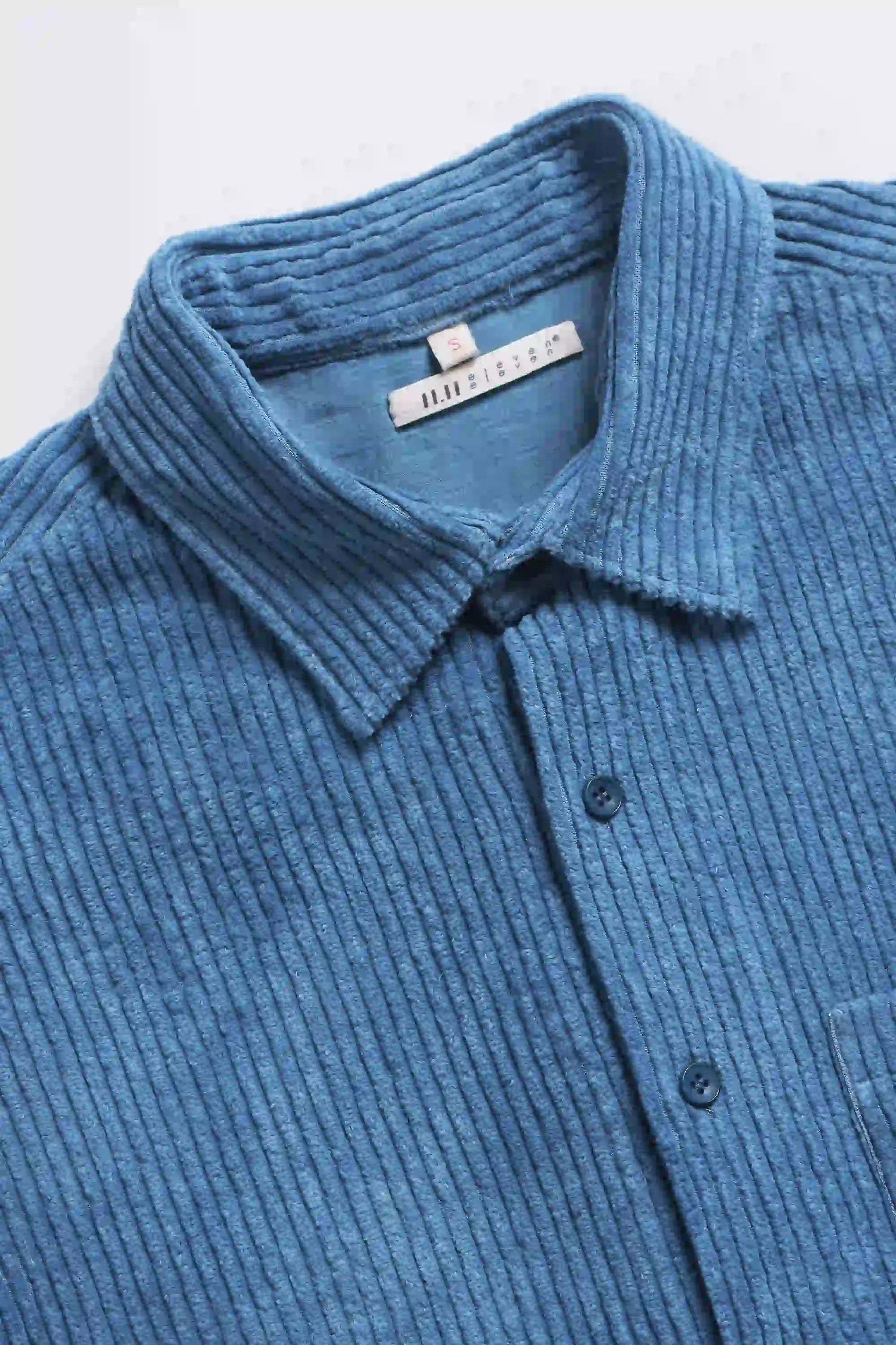 Fabric close-up with buttons and collar