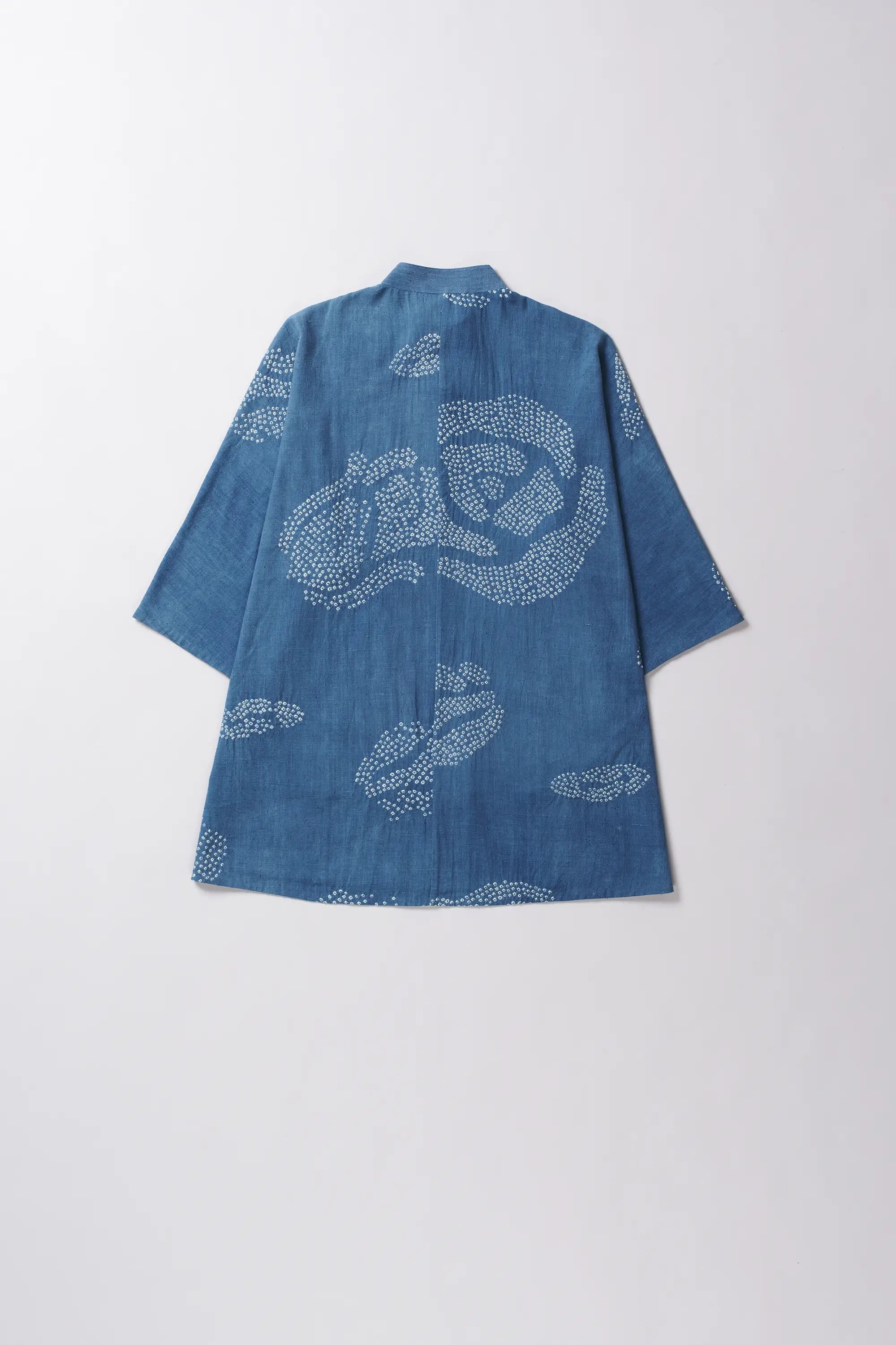 Blue shirt with bandhani on a light grey background