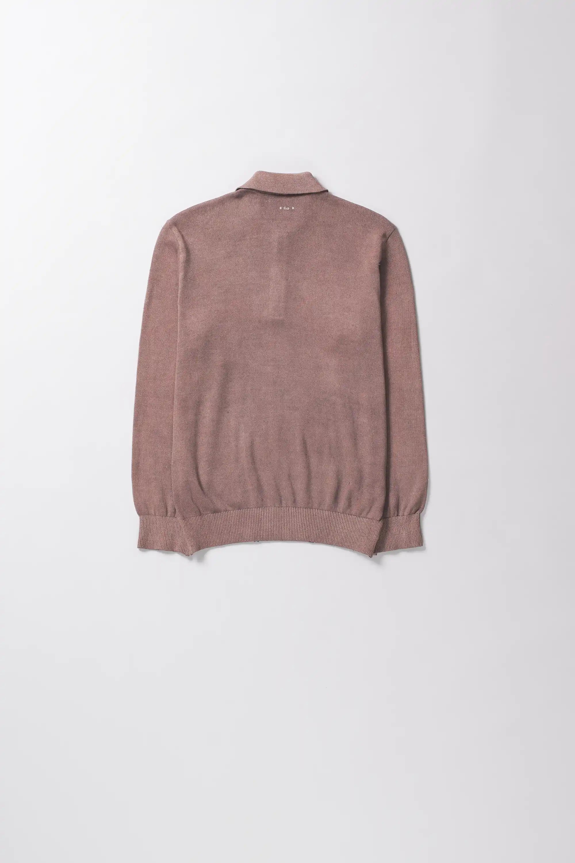 Brown sweater on a light grey background
