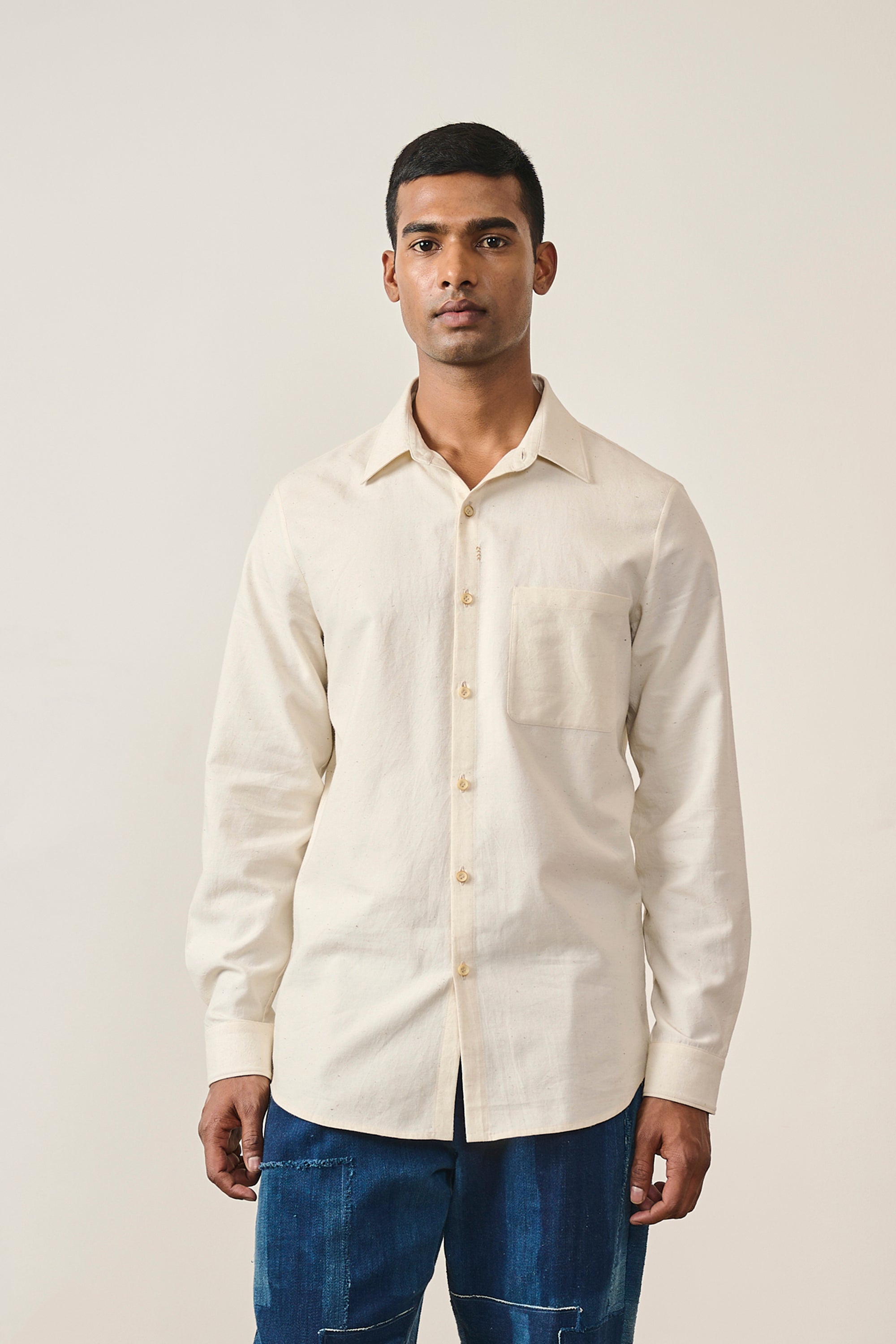 A man wearing ecru cotton shirt