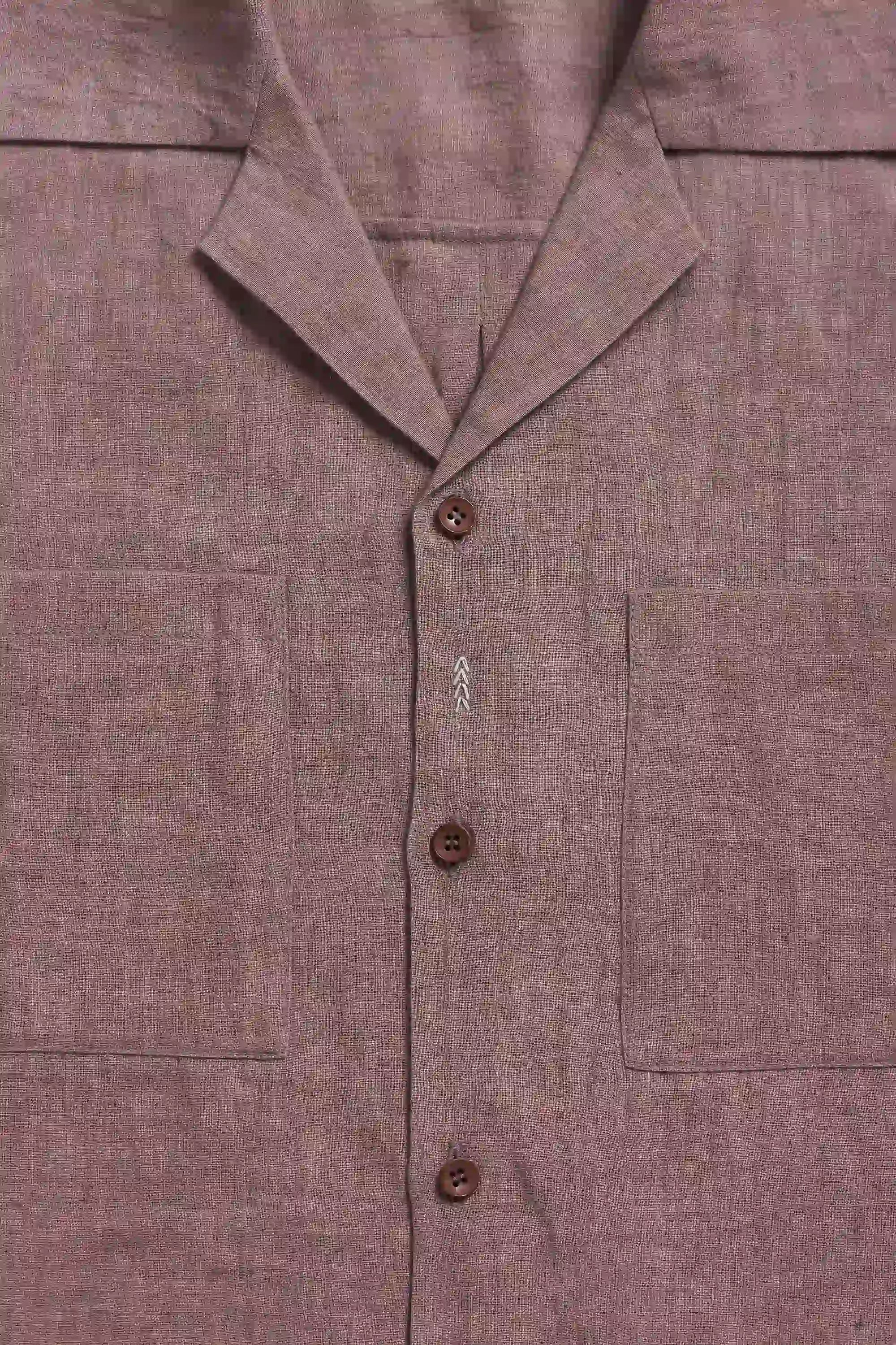 Close-up of a shirt with buttons and collar details and pocket