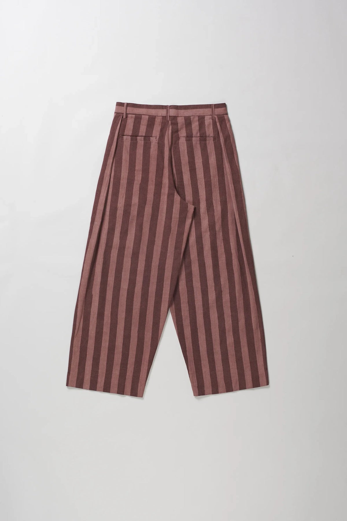 A pair of wide-leg cropped trousers with vertical stripes in dusty rose and dark brown, laid flat against a light grey background.
