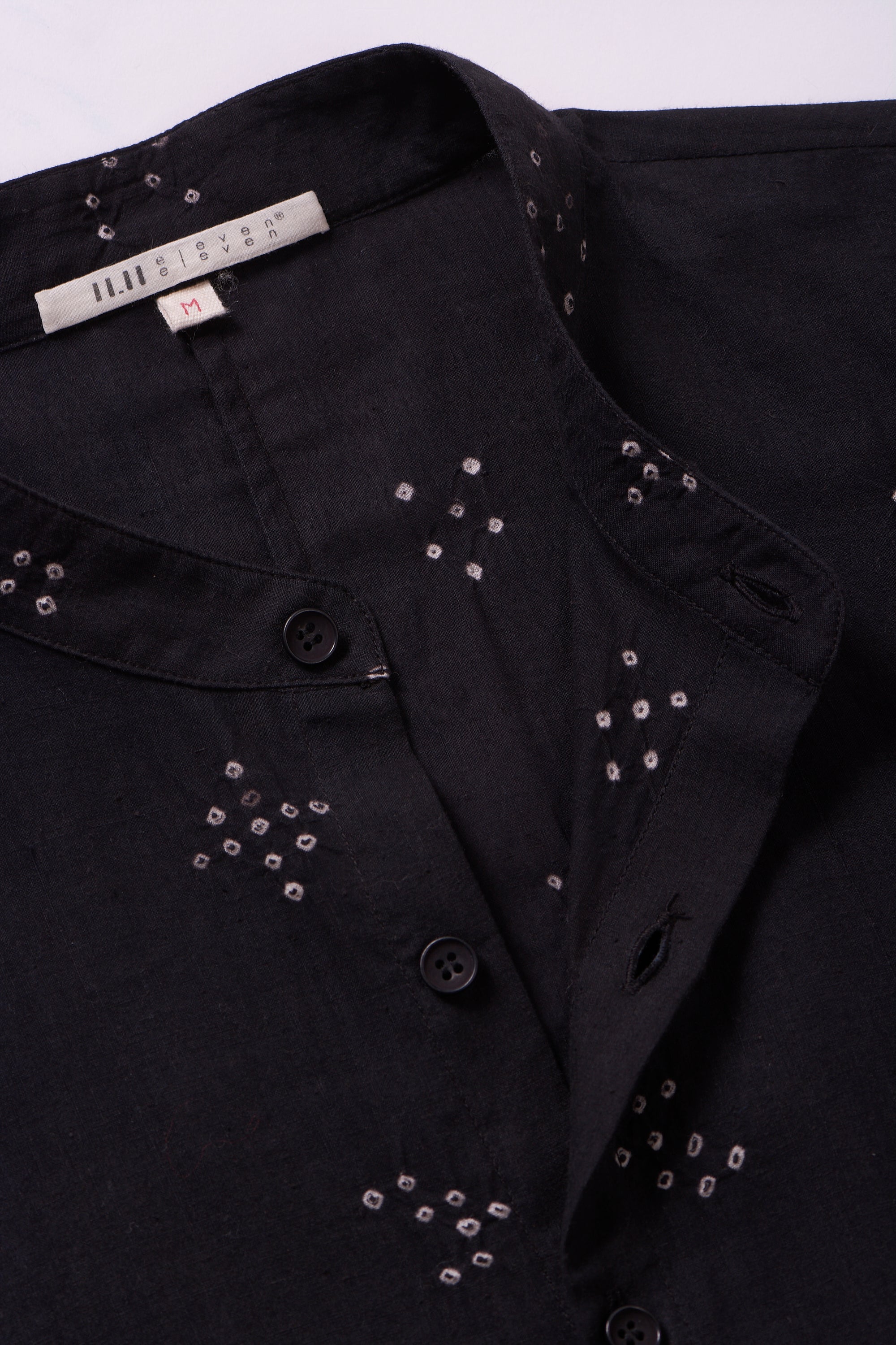 Fabric close-up with band collar and button
