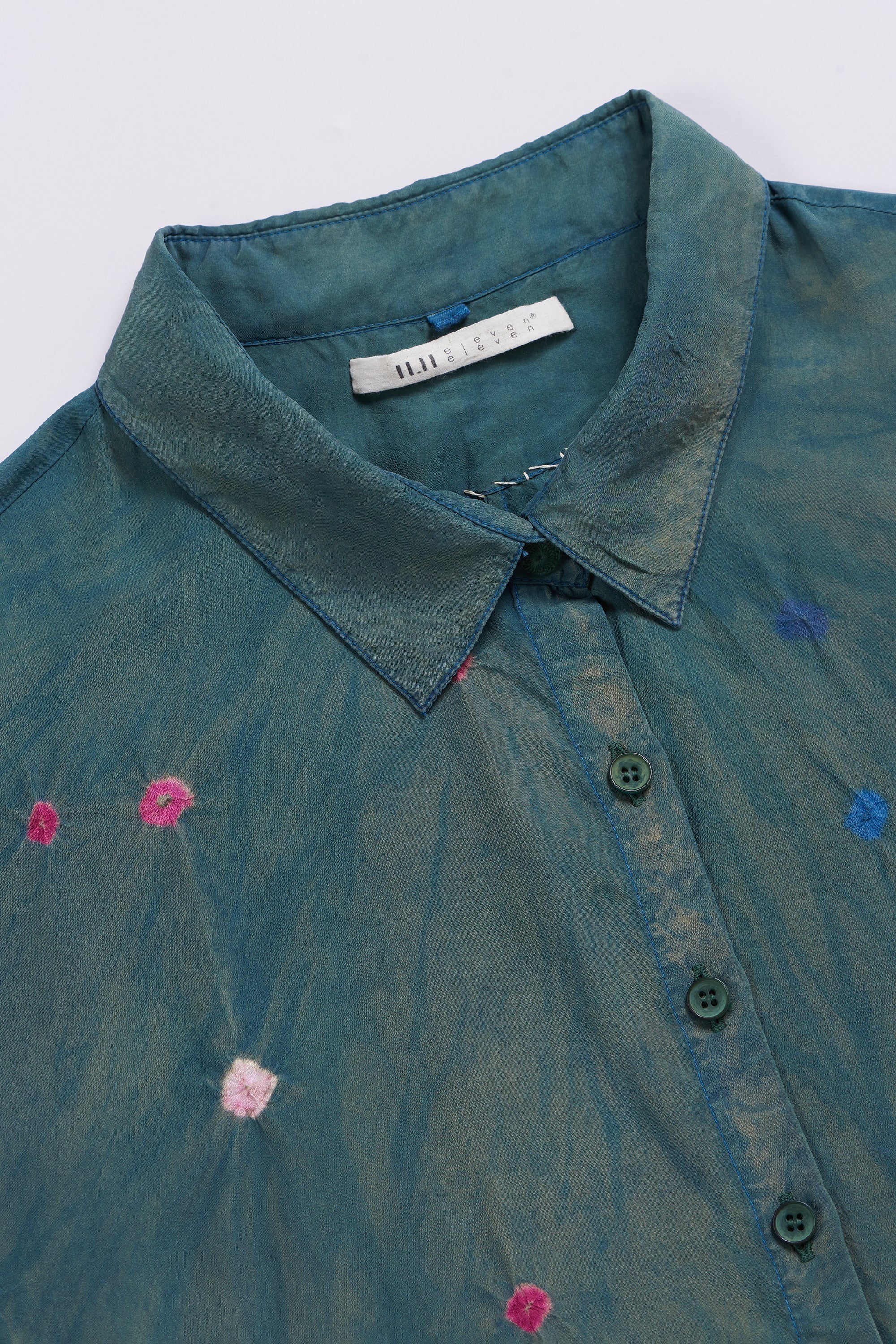 Teal shirt with floral embroidery