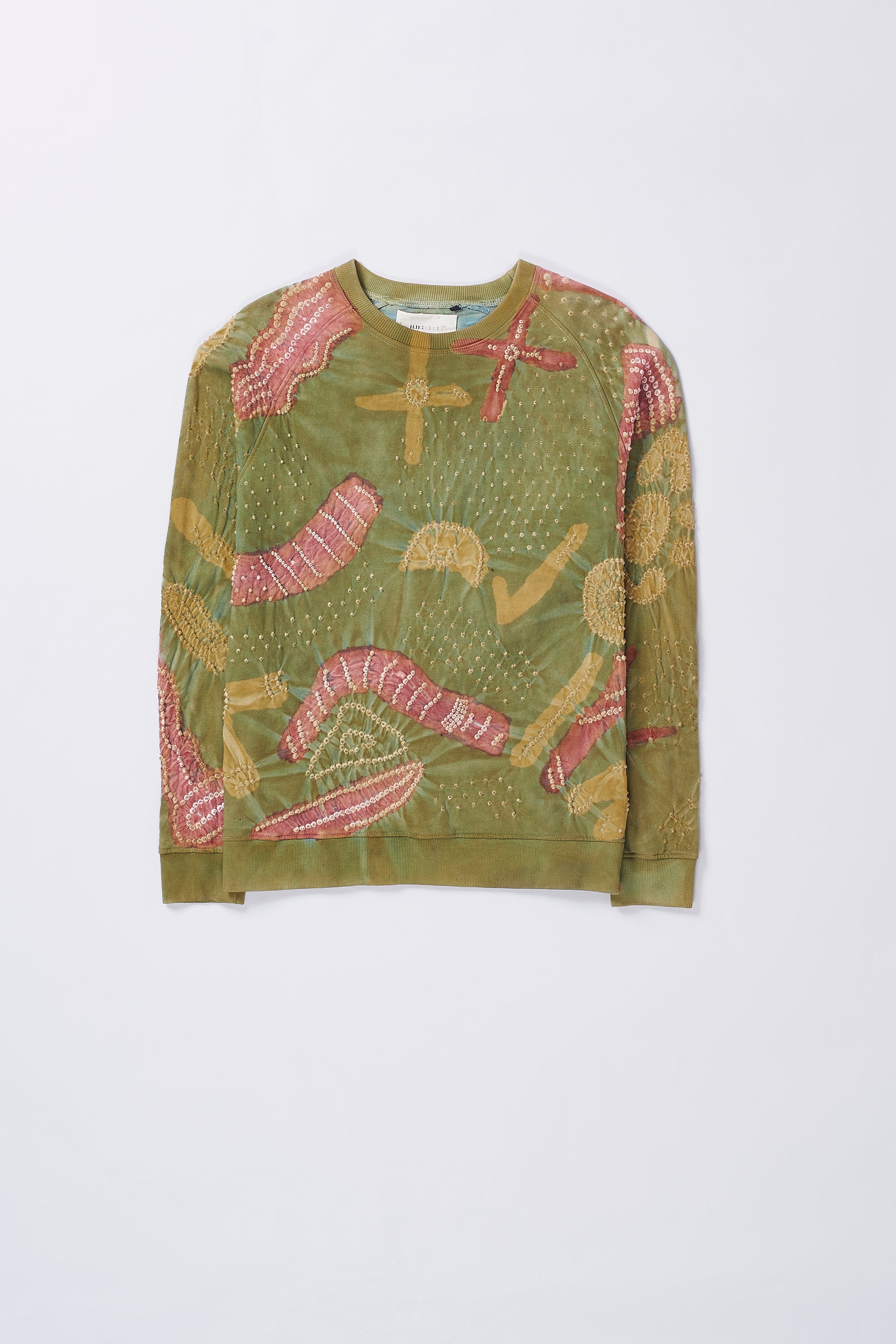 Front image of moss green patterned sweatshirt and crimson pink pants on a grey background