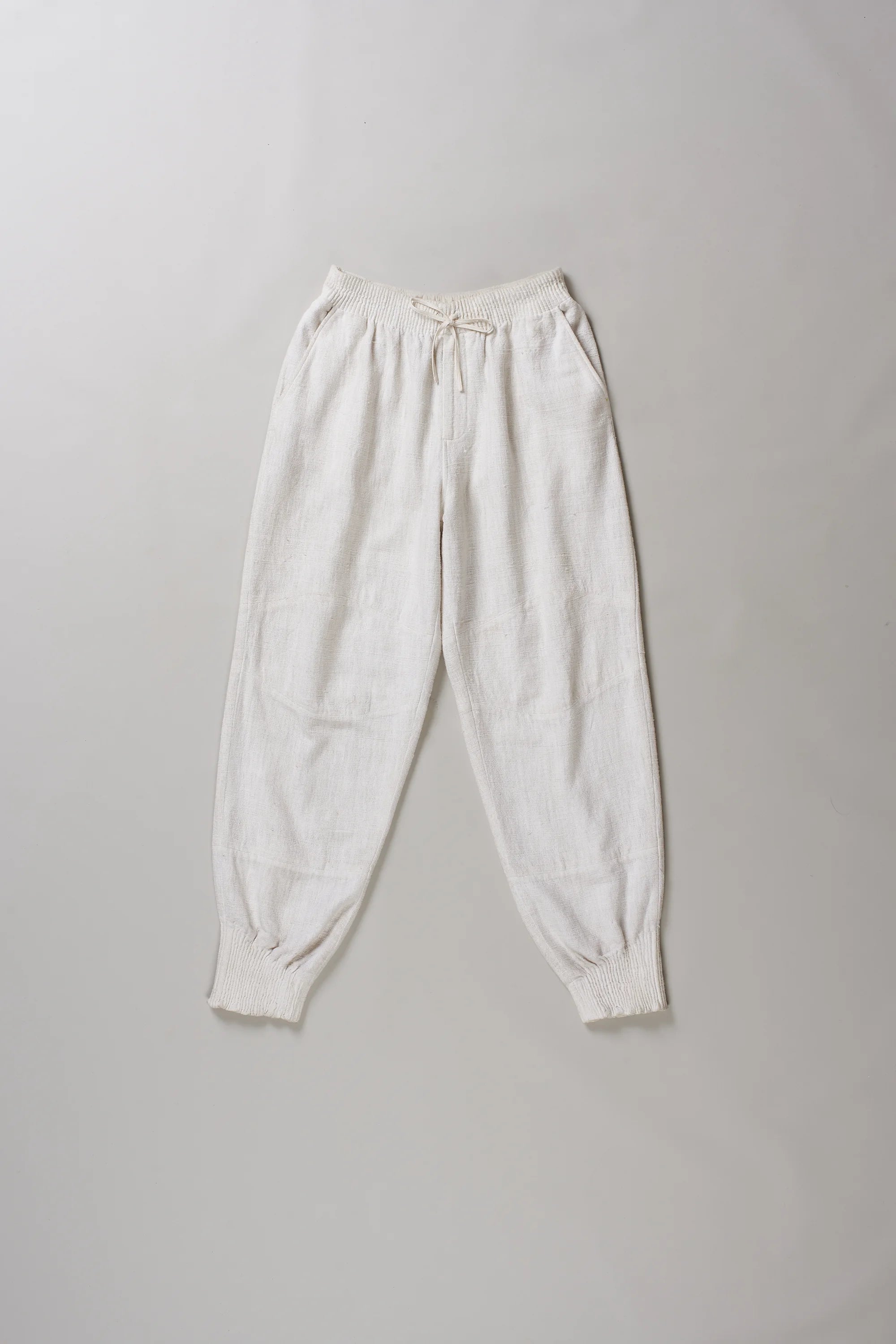 Front image of ecru cotton pant