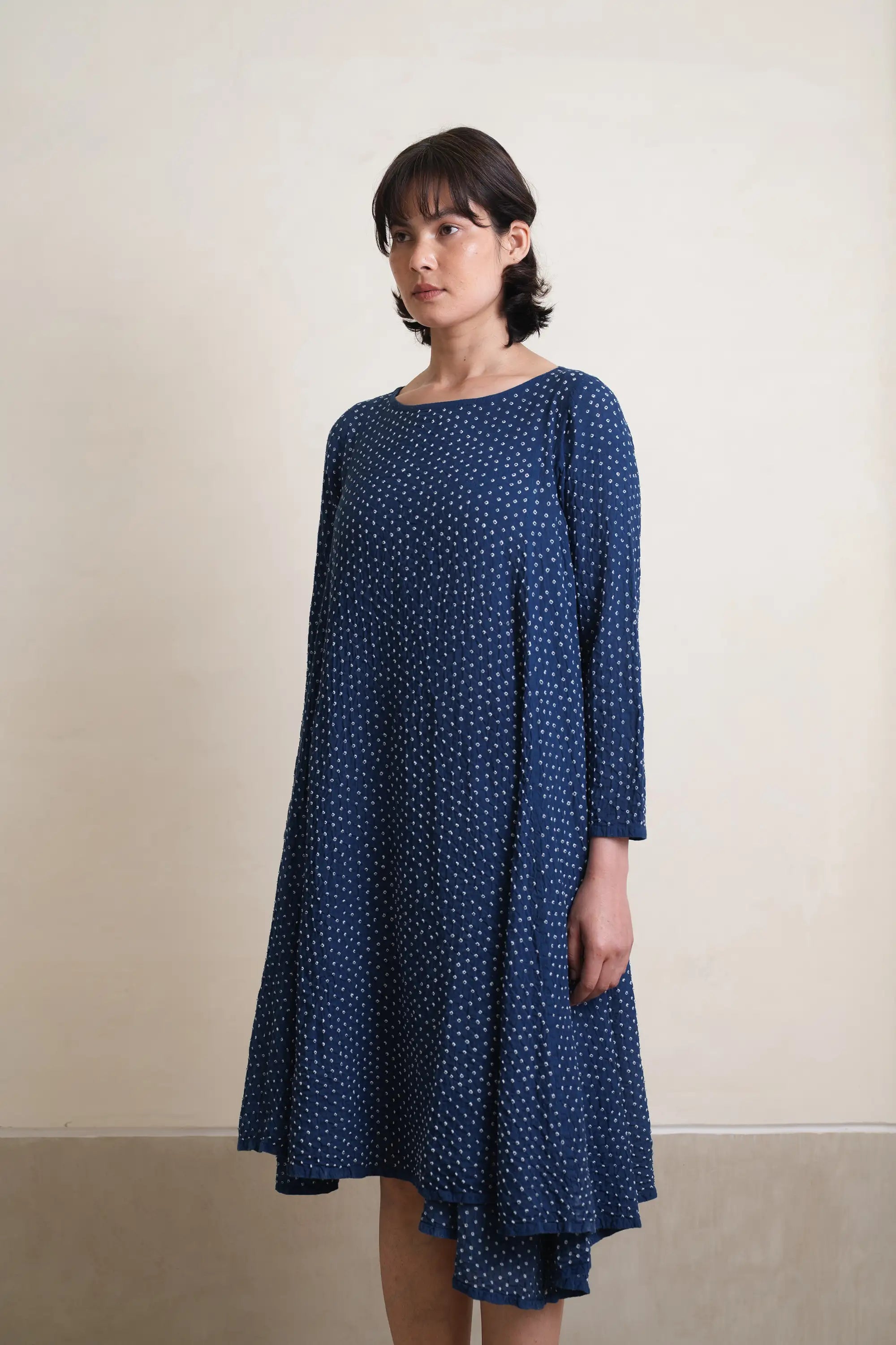 A woman wearing medium indigo dress