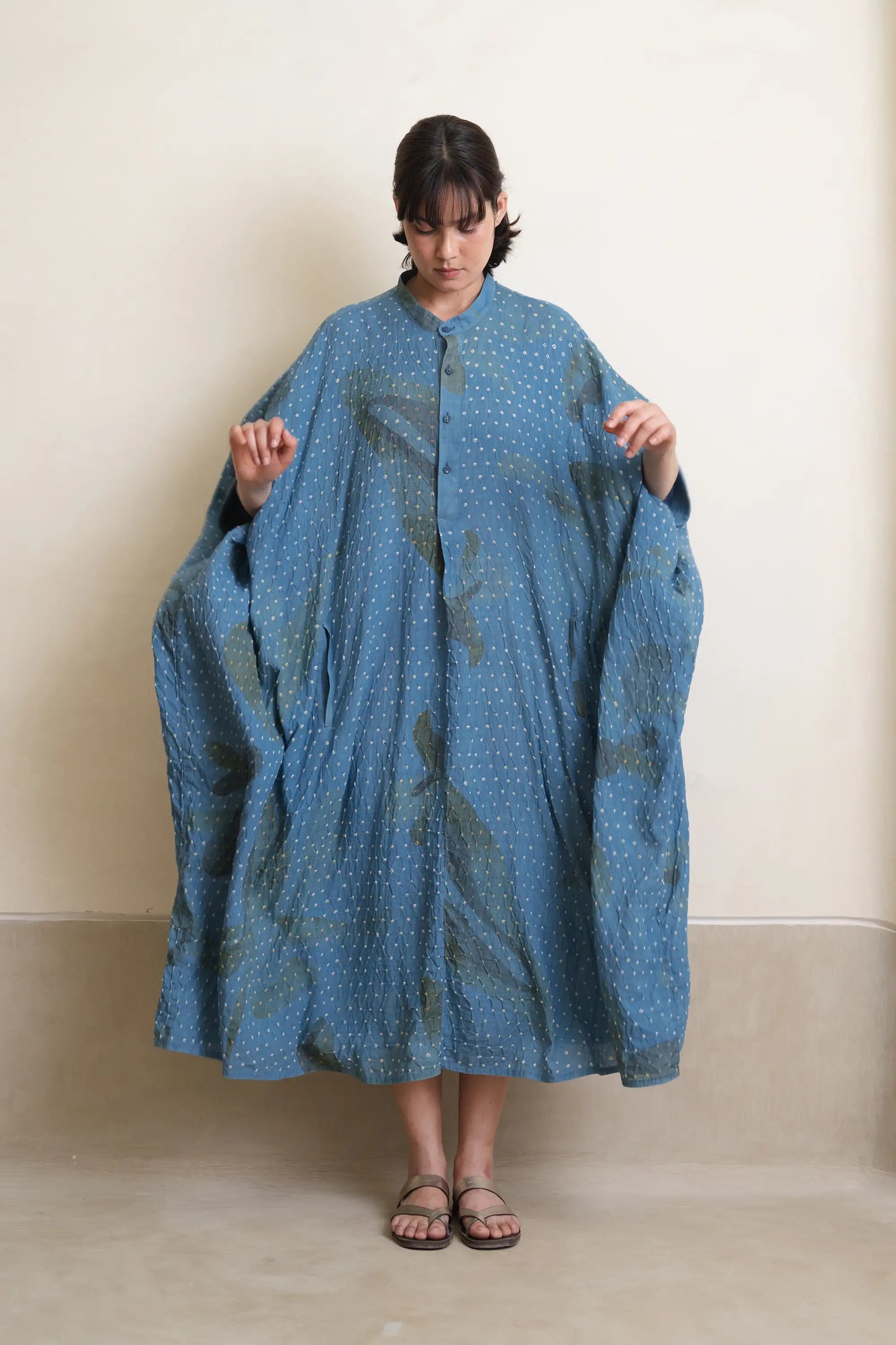 A woman wearing cotton light indigo dress