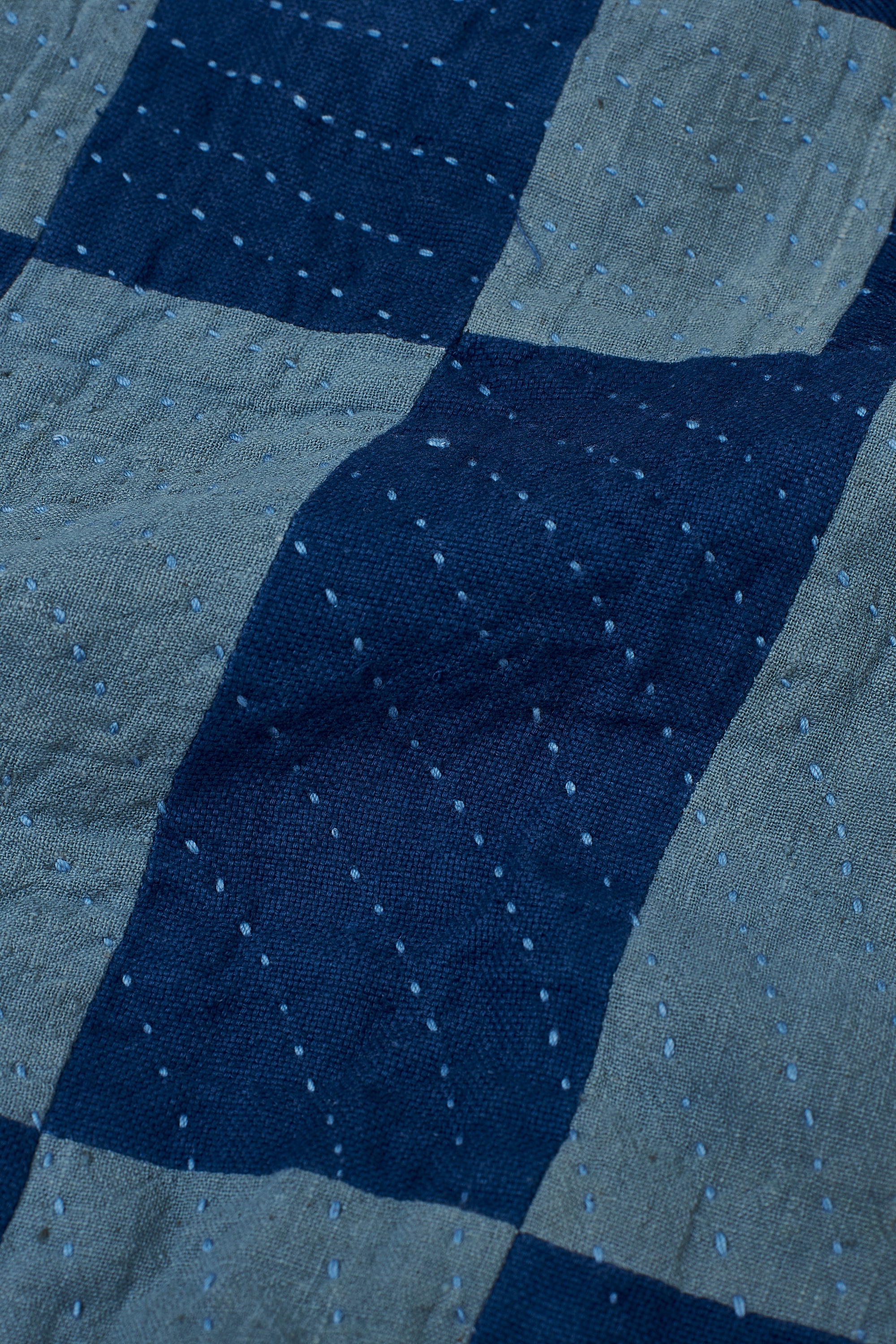 CHEQUERED PATCHWORK CUSHION IN SHADES OF INDIGO