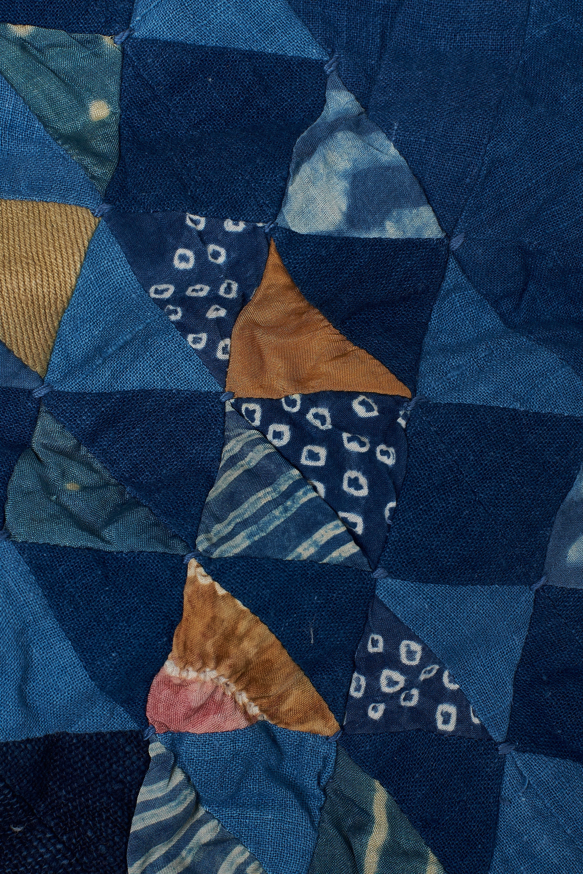 ANGULAR PATCHWORK CUSHION IN SHADES OF INDIGO