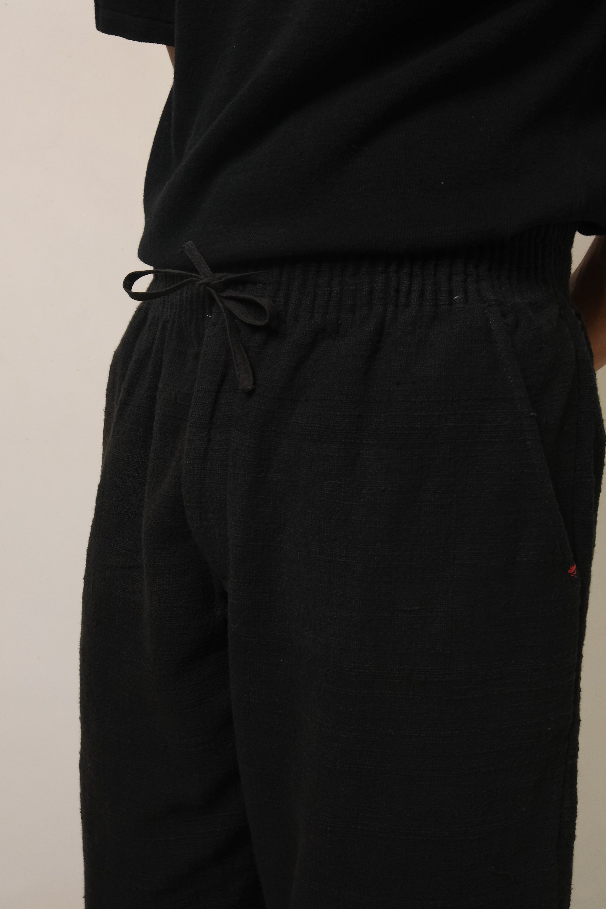 A man wearing black cotton pant