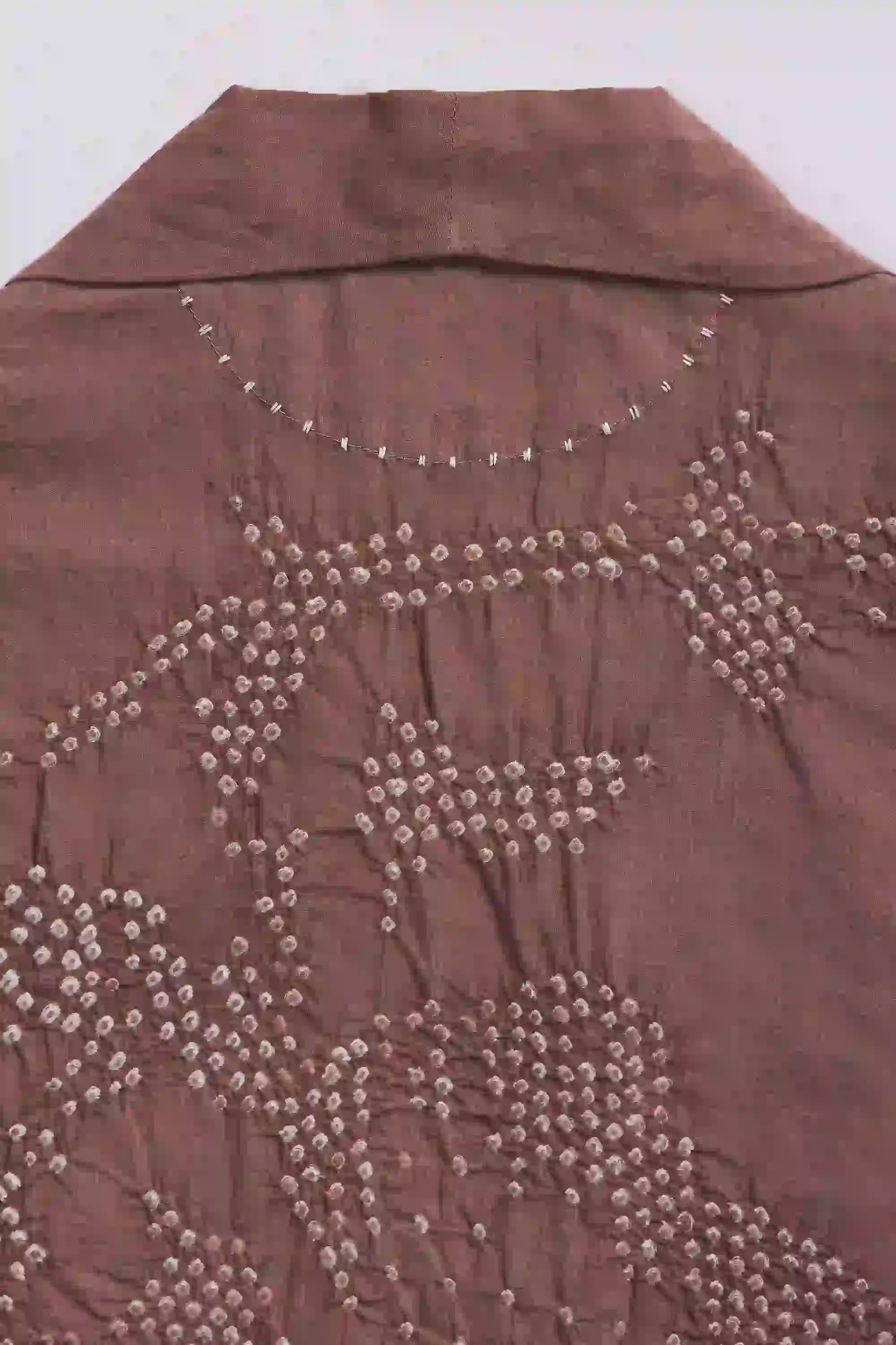 Fabric close-up with hand detail