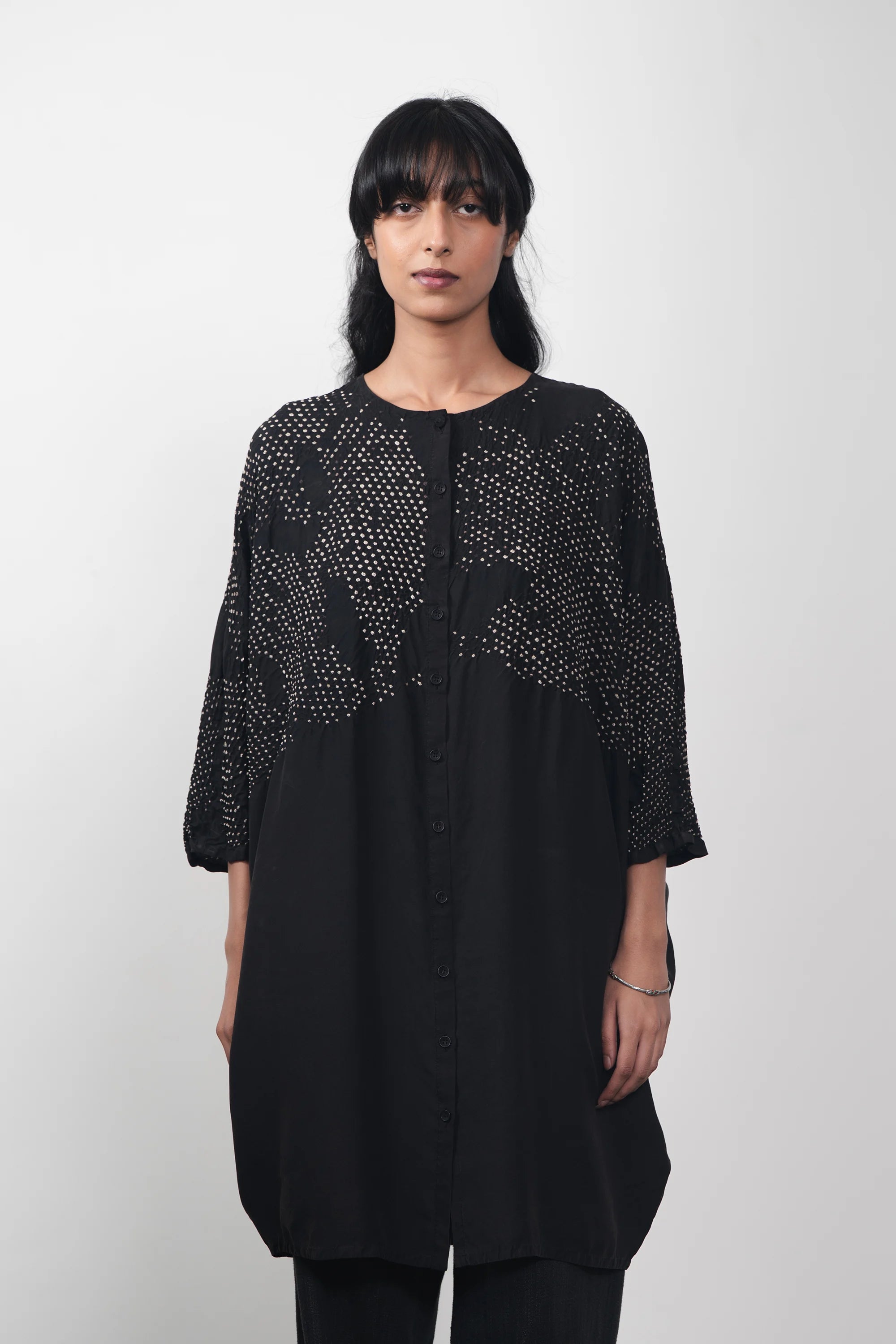 A women wearing black silk dress