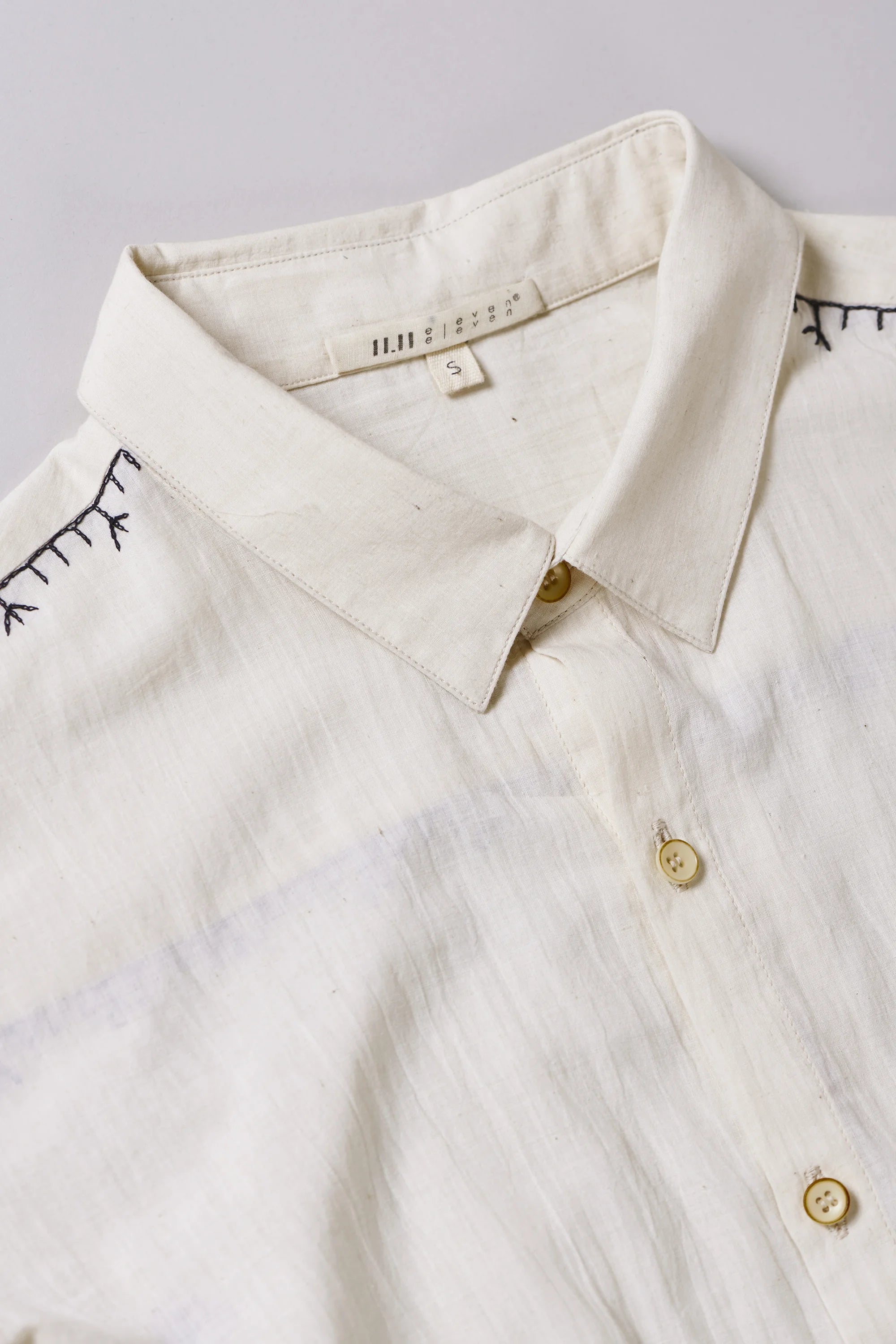 Fabric close-up with collar and buttons