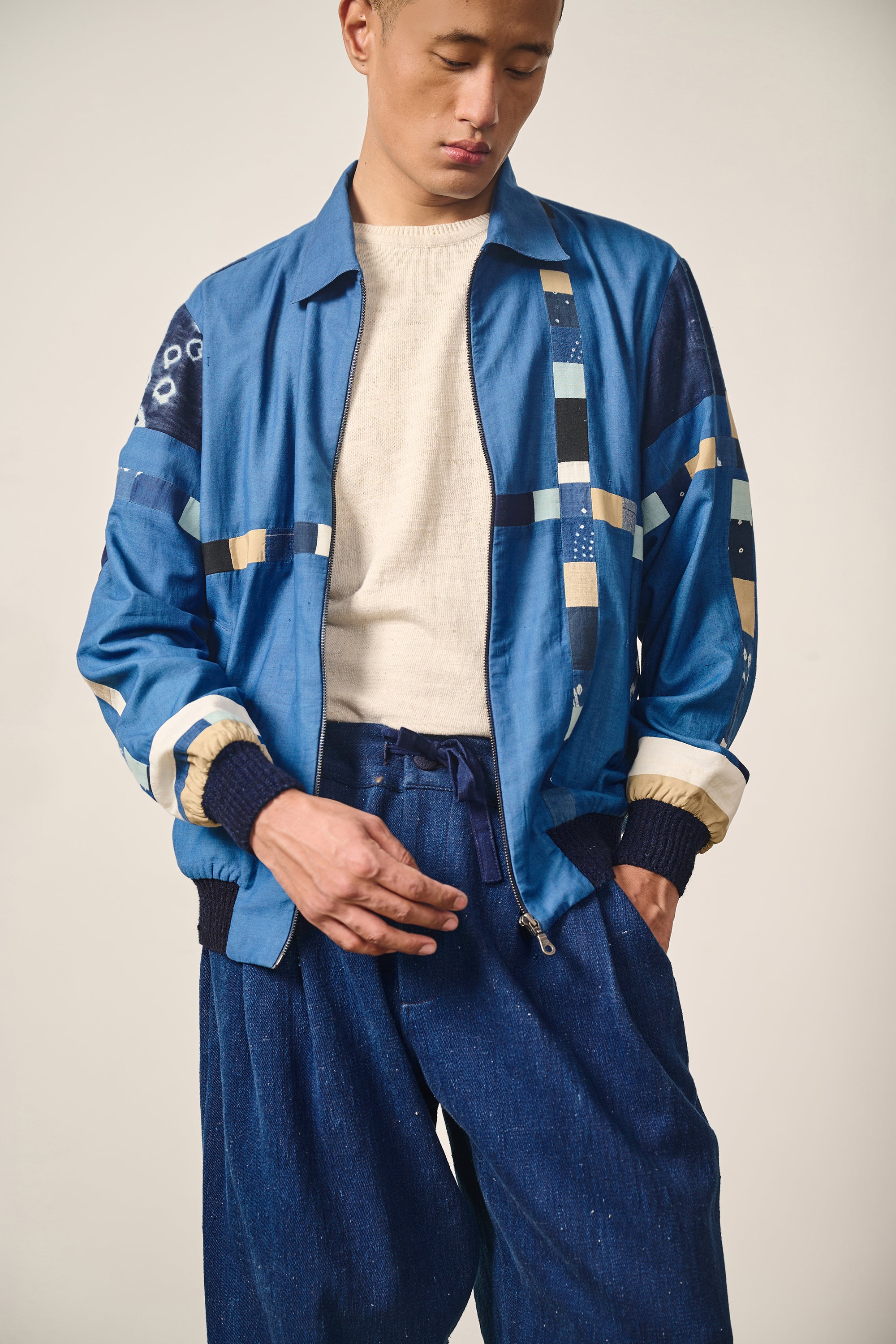 A man wearing indigo jacket