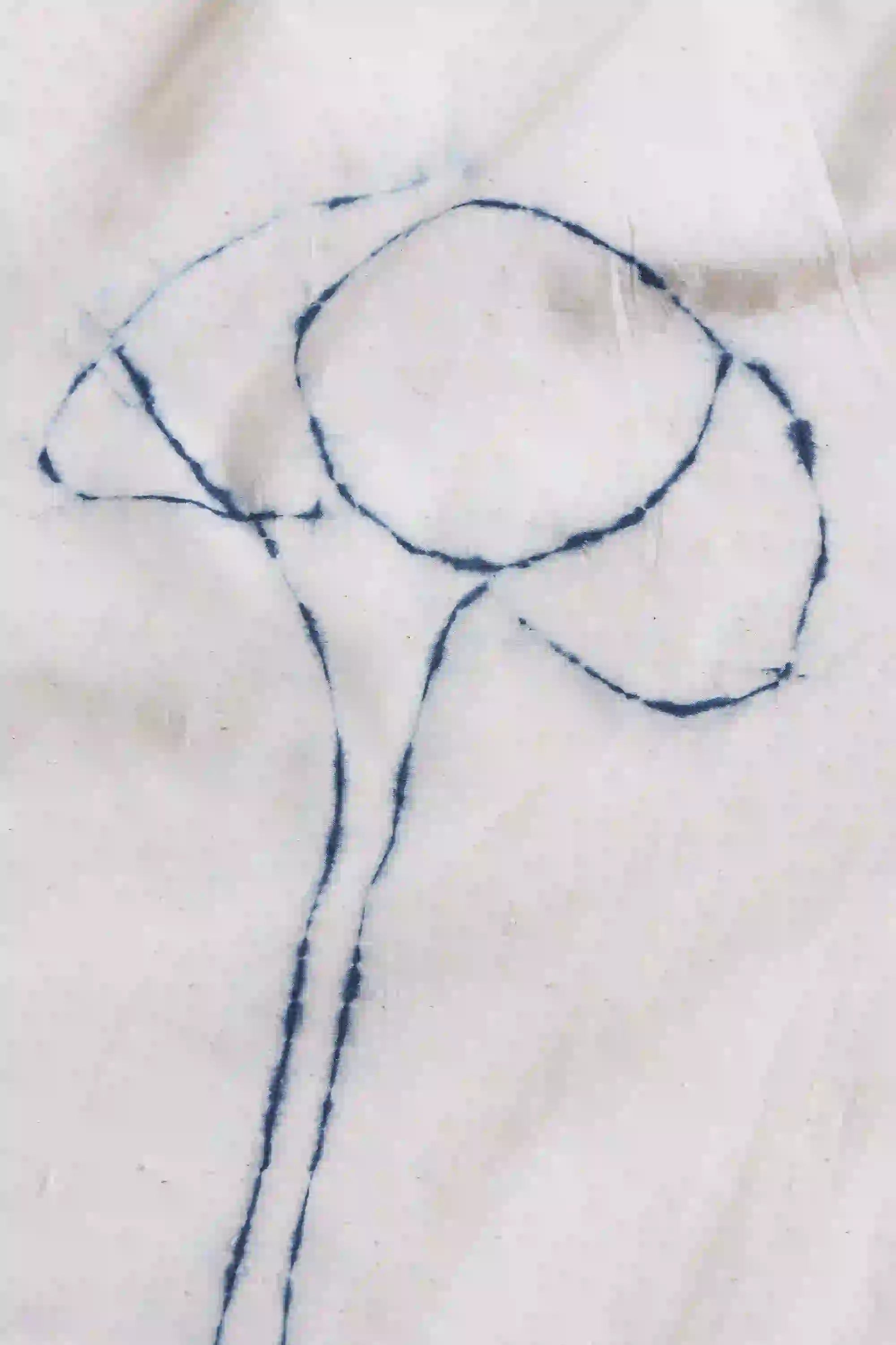 Blue line drawing on a white fabric background