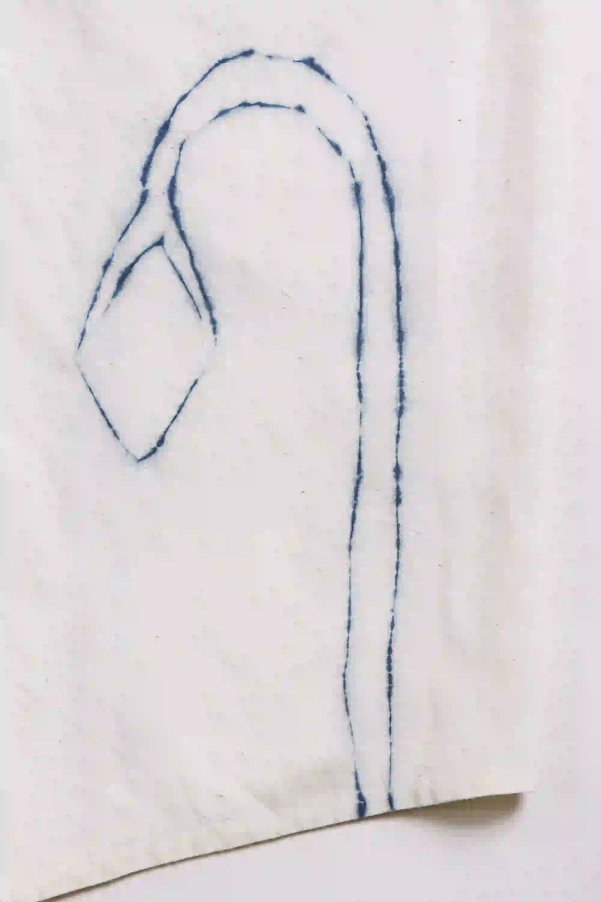 Blue embroidered design on a white fabric