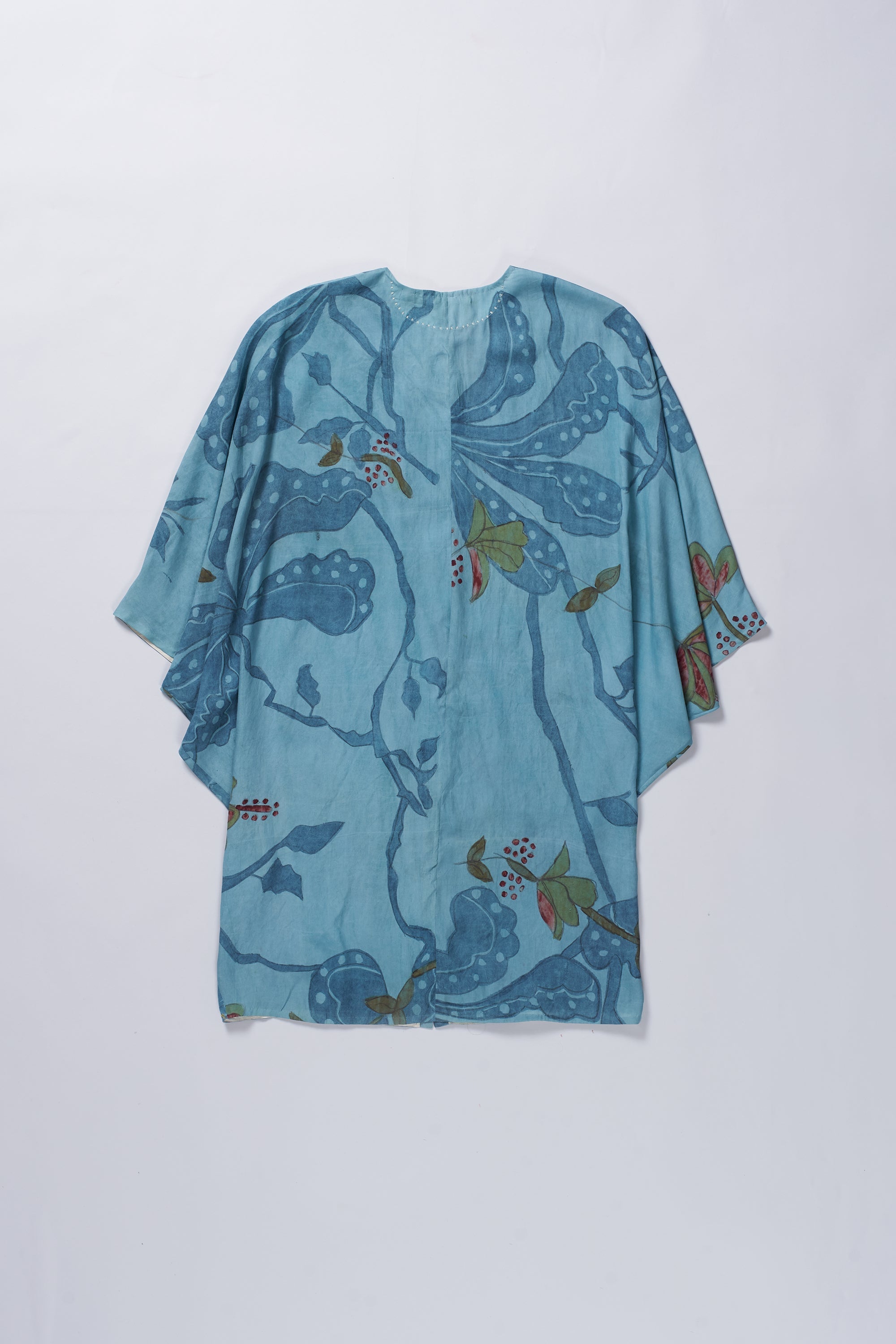 Blue floral kimono-style garment on a white background
