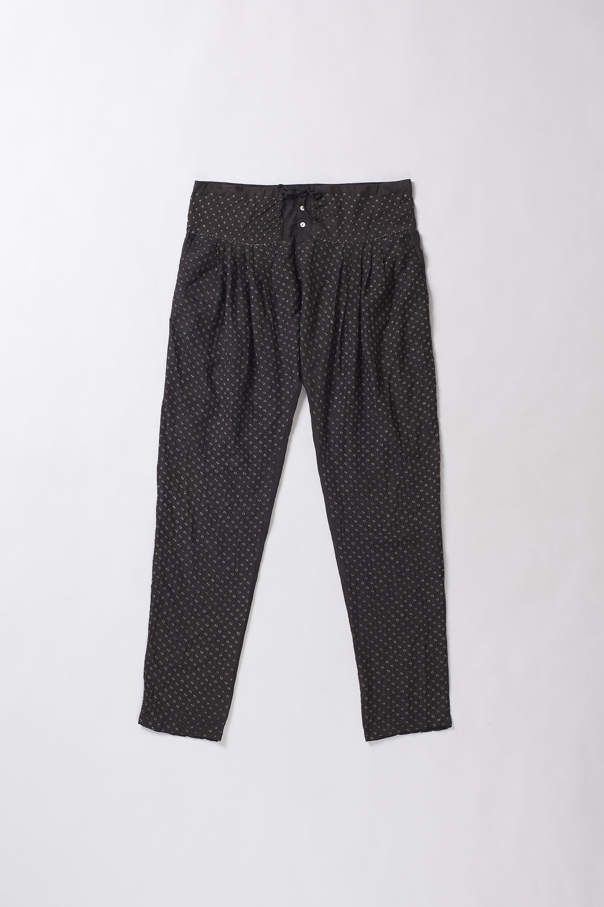 Black pants with white polka dots