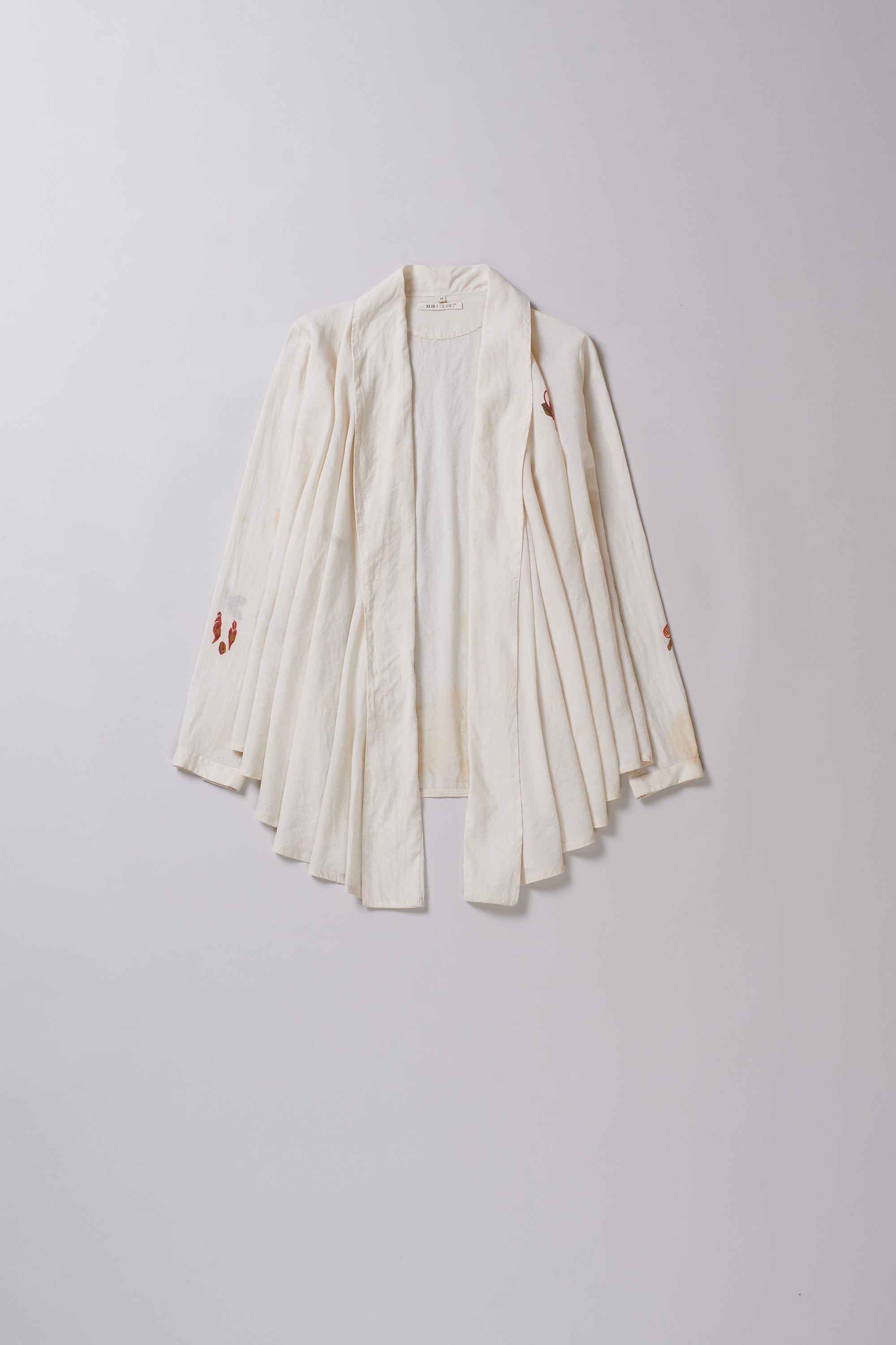 White robe with red accents