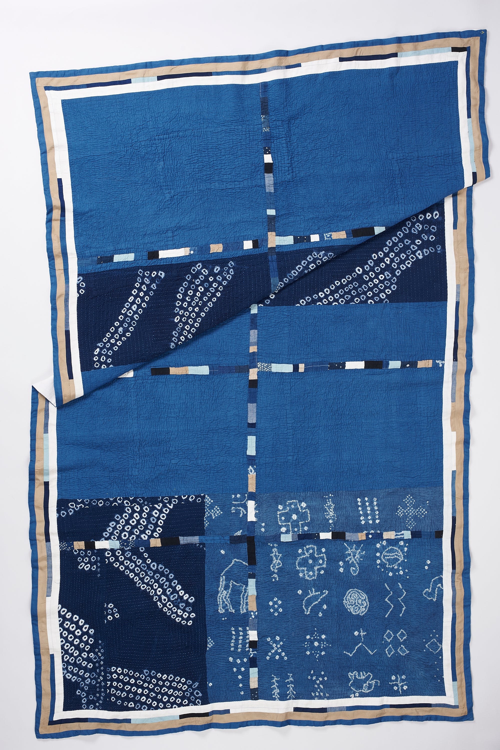 HAND EMBROIDERED PATCHWORK QUILT IN SHADES OF INDIGO